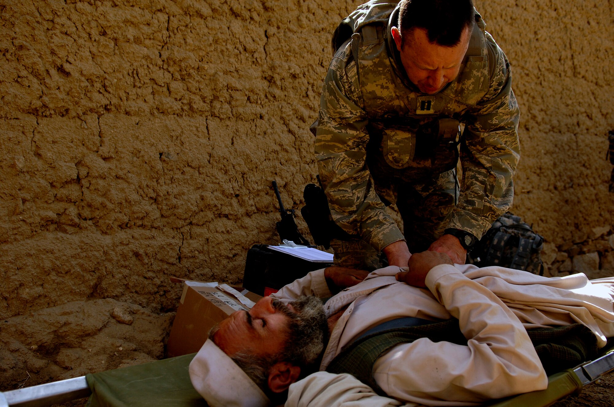 U.S. Air Force Capt. Marshall Fiscus examines a patient April 19, 2008, during a Village Medical Outreach at the Joybar village conducted by the Provincial Reconstruction Team, Bagram Air Field Afghanistan. Fiscus is the Chief Medical Officer assigned to the PRT and is deployed from Geilenkirchen, Germany. (U.S. Air Force photo by Master Sgt. Andy Dunaway) (Released)
