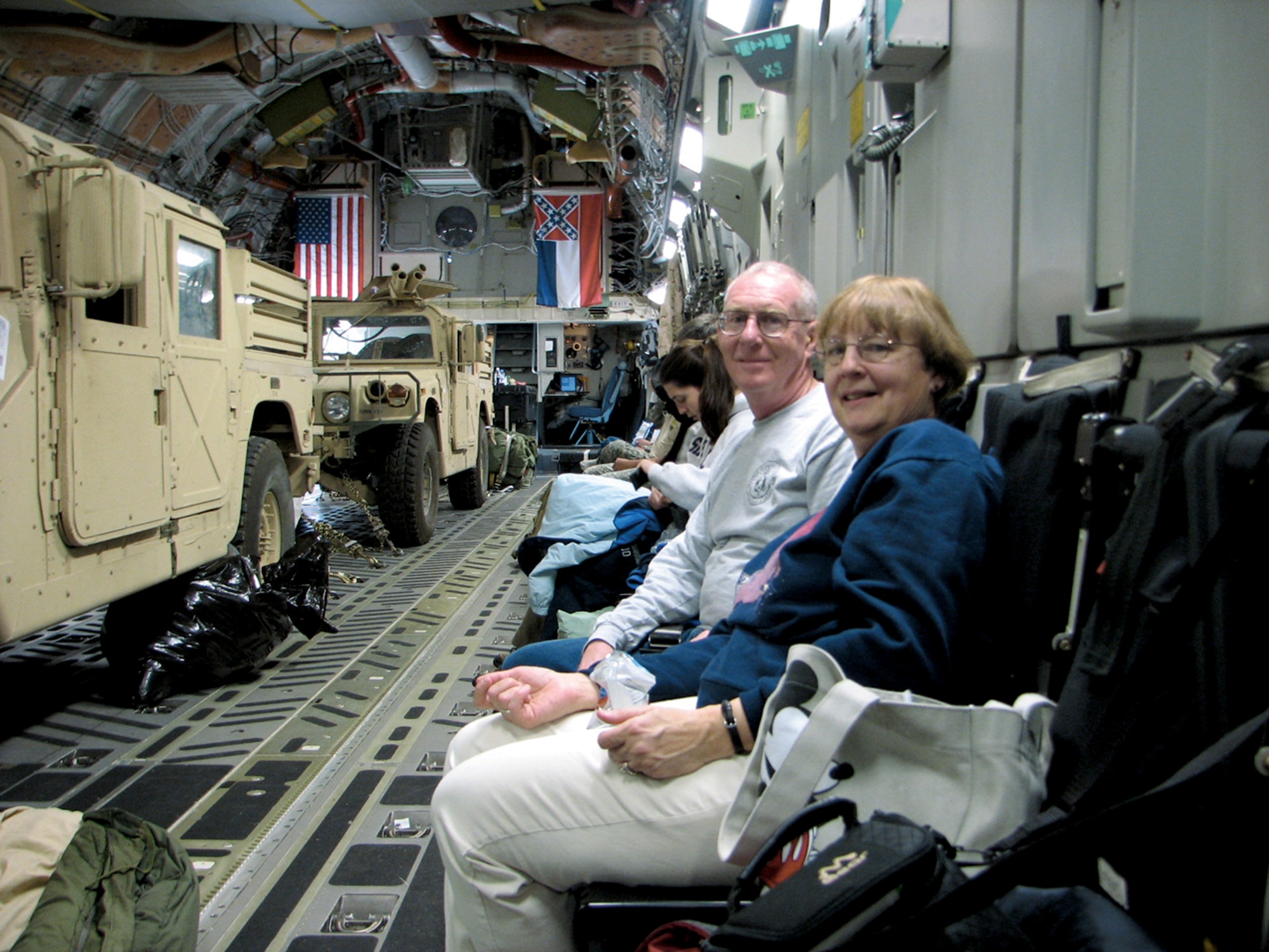 Retired Col. John Tilford, second from right, and his wife Polly caught a space available flight aboard a C-17 from England to Pope Air Force Base, N.C., in March 2008. (Courtesy photo)
