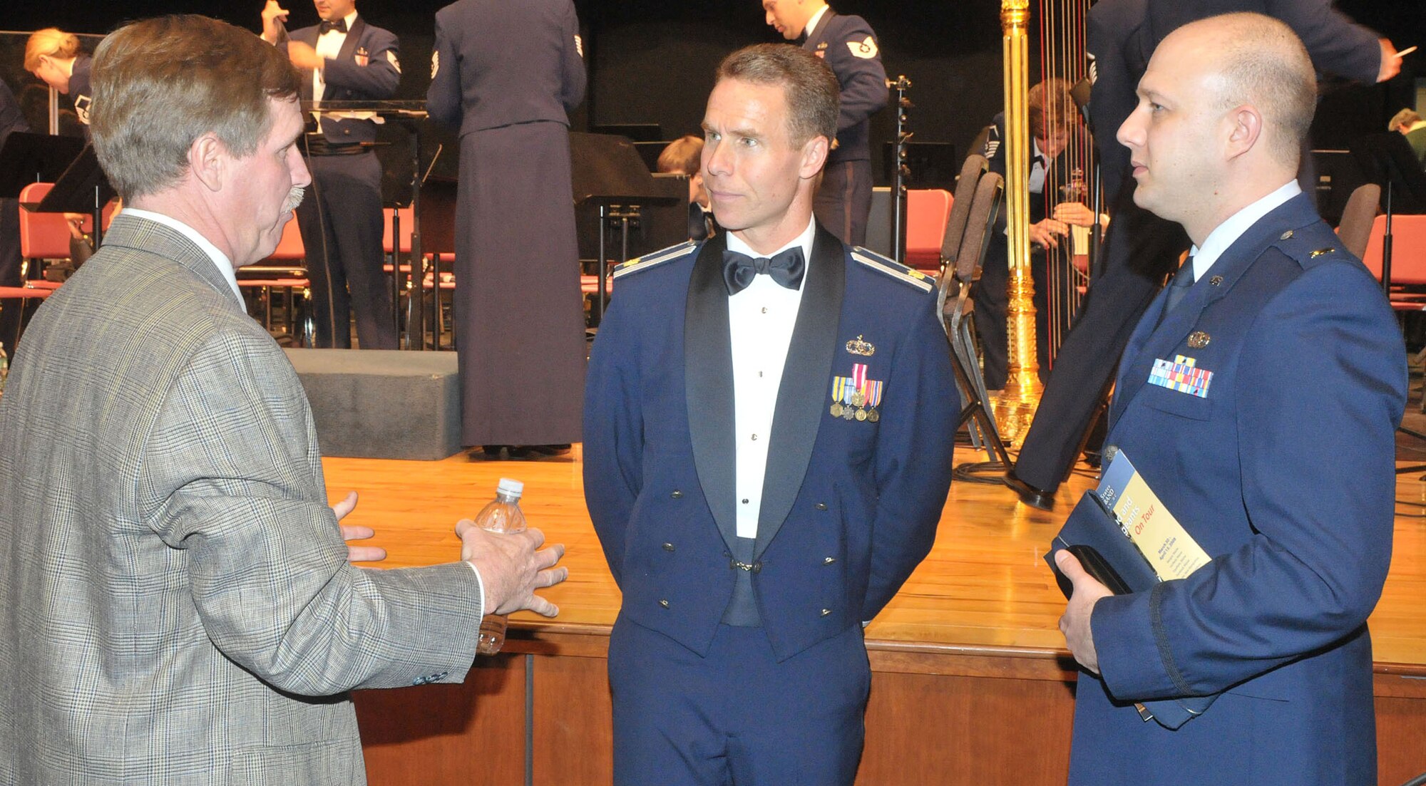 First Lt. David Alpar (right), commander of the Air Force Band of Liberty at Hanscom, chats with Maj. Keith Bland, Squadron Section commander for the United States Air Force Band from Bolling Air Force Base, Washington D.C. and Michael P. Mulrenan of the Woburn, Mass. School Committee, following a performance by the USAF Band and the Air Force Singing Sergeants at Woburn Memorial High School April 10. (Courtesy photo by Joe Brown) 

 


