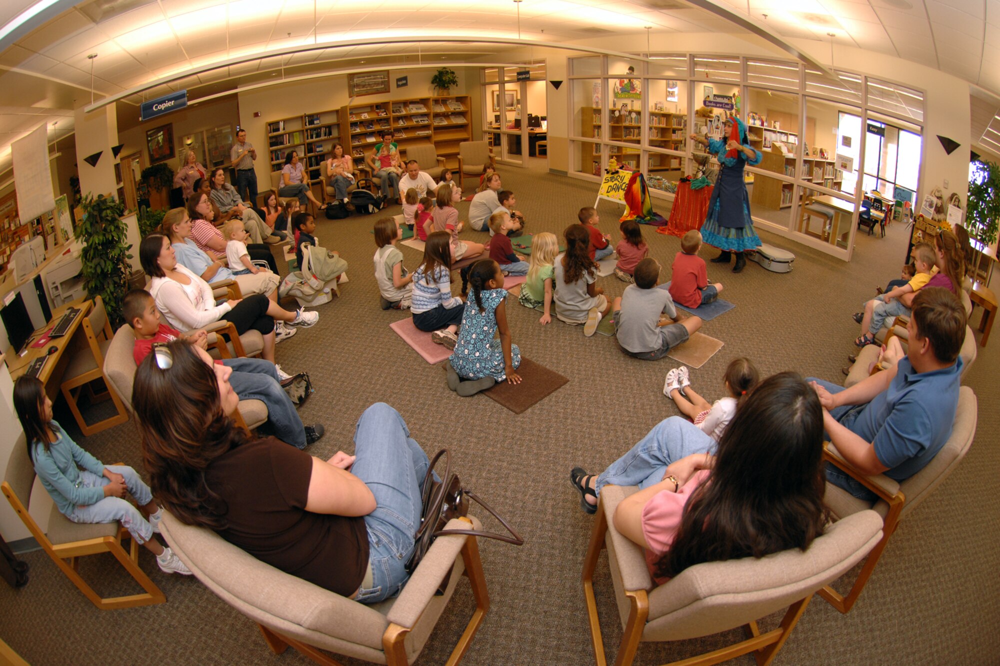 HOLLOMAN AIR FORCE BASE, N.M. -- Terry Alvarez, story dancer, performs a song April 16 at the base library here. More than 40 parents and children showed for the performance in celebration of National Library Week. (U.S. Air Force photo/ Airman 1st Class Jamal D. Sutter)