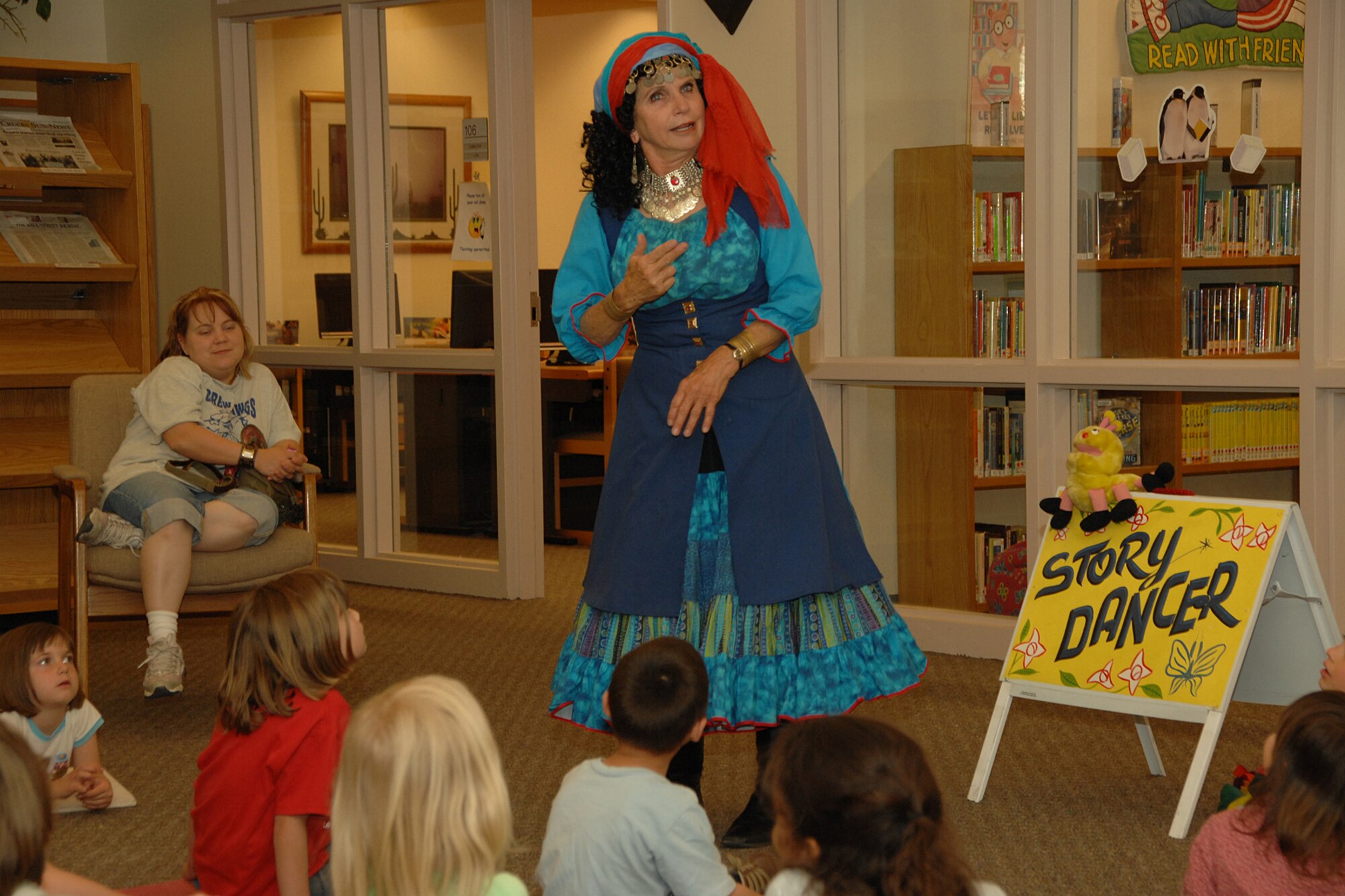 HOLLOMAN AIR FORCE BASE, N.M. -- Terry Alvarez, story dancer, tells a folktale to children April 16 at the base library here. Alvarez tells stories to people of all ages and uses dance and song in her performances. (U.S. Air Force photo/ Airman 1st Class Jamal D. Sutter)
