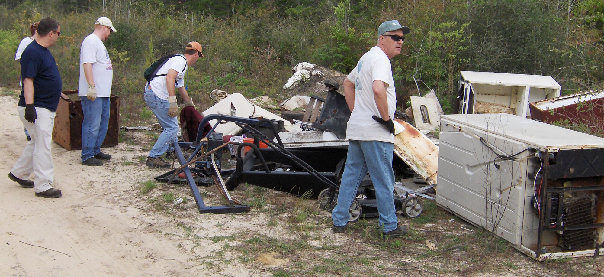 EGLIN AIR FORCE BASE, Fla. -- In celebration of Earth Day, volunteers rolled up their sleeves and cleaned up 25,000 pounds of trash from a dump site on the Eglin reservation on April 10. (U.S. Air Force photo by Jim Reese)