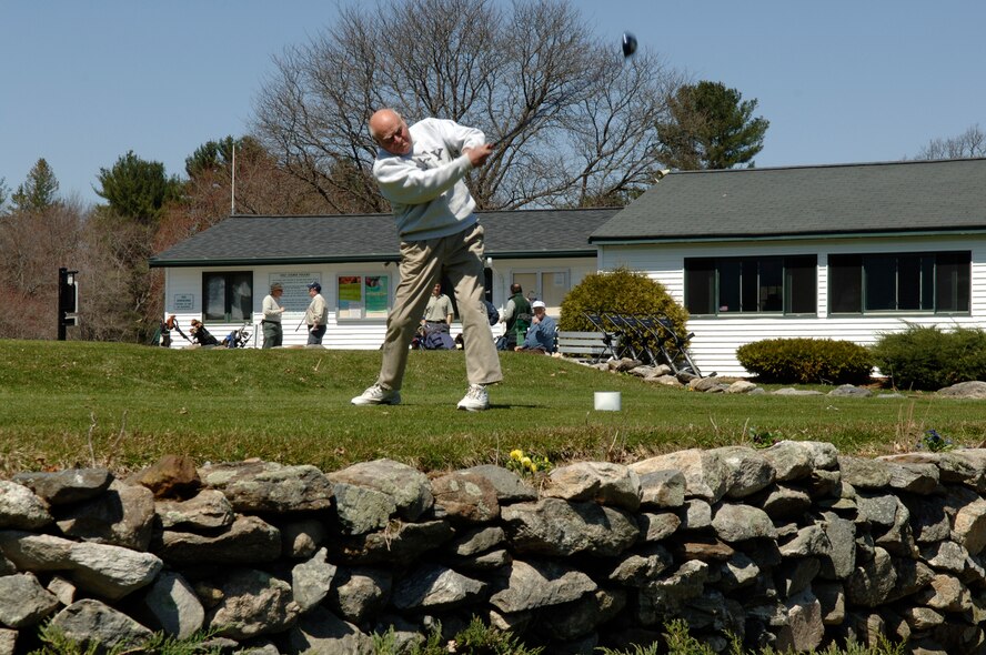 HANSCOM AFB, Mass. – A Patriot Golf Course customer tees off at the first hole on opening day, April 15. The facility includes a nine-hole regulation golf course, driving range, practice putting and chipping greens and a full-service golf shop and snack bar. The course offers private and group golf lessons, a Golf 4 Kids program and Link Up 2 Golf, a $99 adult golf clinic. For more information call 781-687-2396 or go online to www.hanscomservices.com. (U.S. Air Force photo by Rick Berry)
