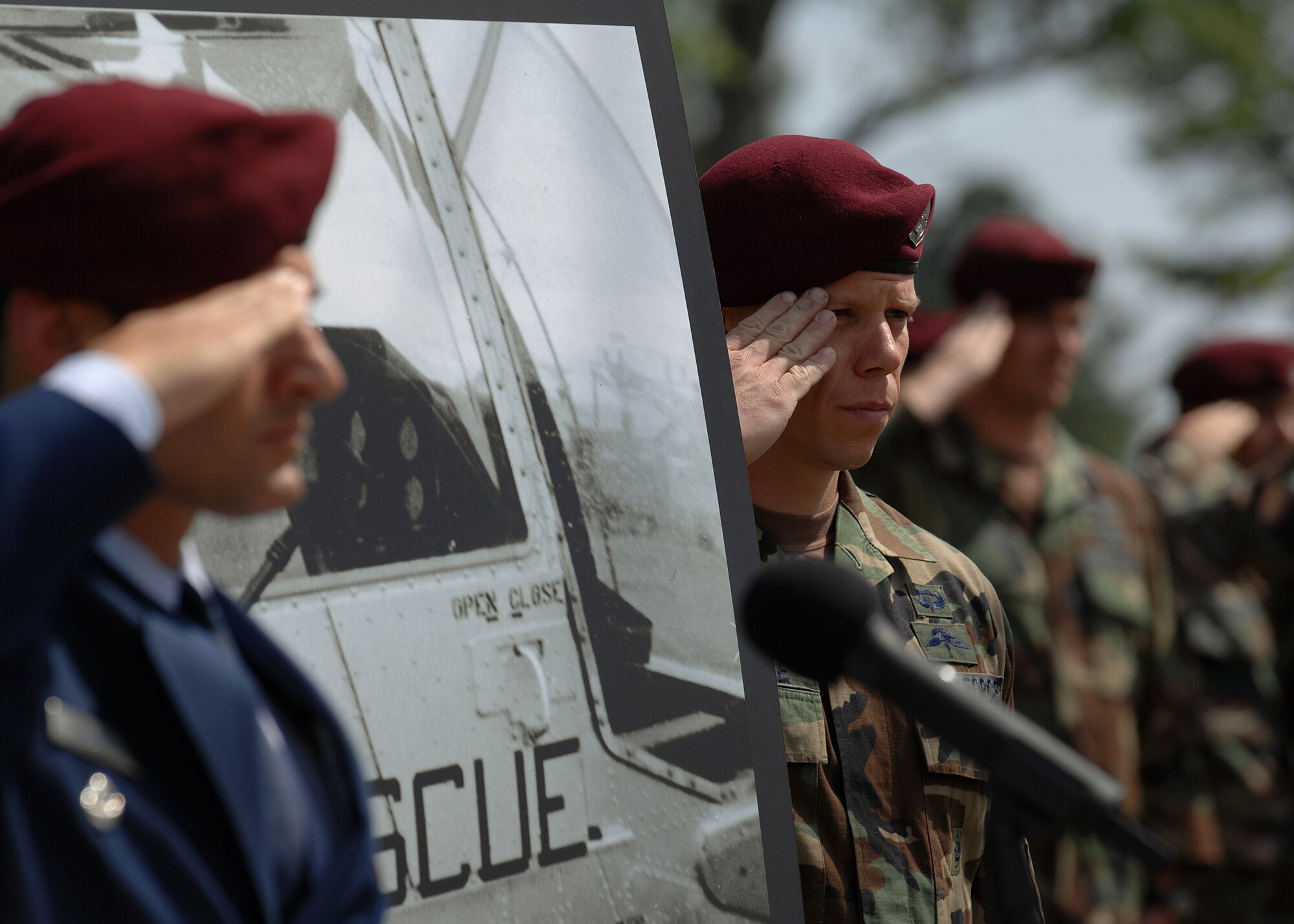 MOODY AIR FORCE BASE, Ga. -- Members of the 38th Rescue Squadron salute during a re-dedication ceremony for Airman 1st Class William H. Pitsenbarger here April 18. Airman Pitsenbarger was awarded the Congressional Medal of Honor Dec. 8, 2000 for his heroic acts during the Vietnam war. (U.S. Air Force photo by Airman 1st Class Brittany Barker)
