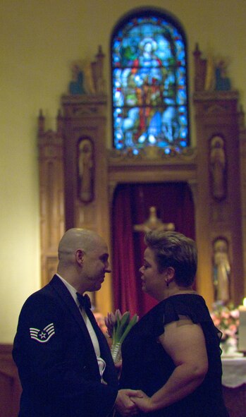 Staff Sgt. Matthew Slaydon and his wife, Annette, renew their marriage vows at Chapel 1, Saturday, April 12, at Randolph Air Force Base, Texas.  Sergeant Slaydon was critically wounded by a terrorist bomb in Iraq in October -- losing his sight, one arm, and suffering multiple facial lacerations and fractures. (U.S. Air Force photo/Tech. Sgt. Matthew Hannen)