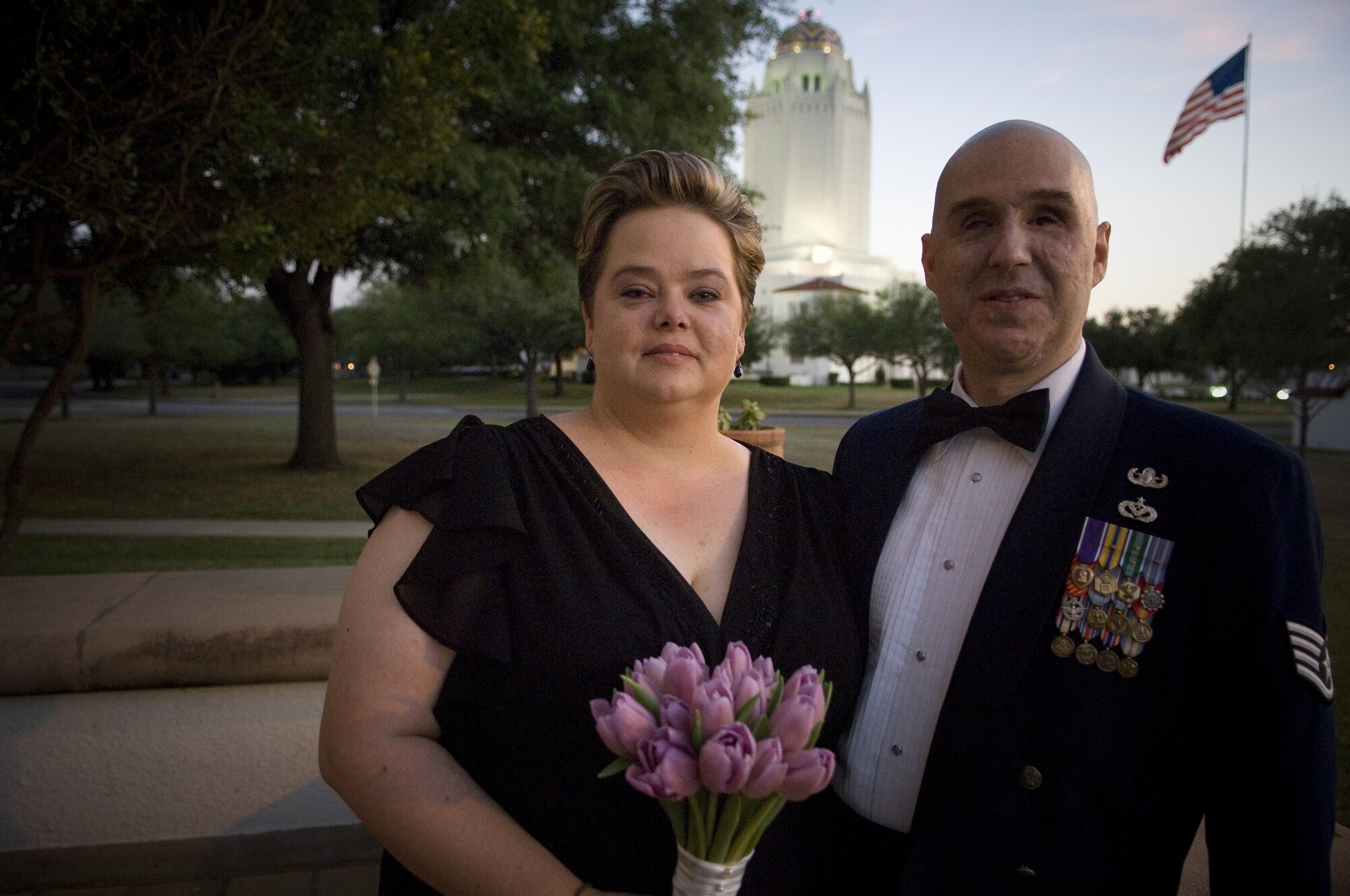 Staff Sgt. Matthew Slaydon and his wife, Annette, pause outside the Randolph Air Force Base chapel at their wedding vow renewal ceremony Saturday, April 12.  Sergeant Slaydon was critically wounded by a terrorist bomb in Iraq in October.  His wife and a host of Air Force members at Randolph and his home station of Luke Air Force Base, Ariz., have helped Sergeant Slaydon focus on recovery. (U.S. Air Force photo/Tech. Sgt. Matthew Hannen)