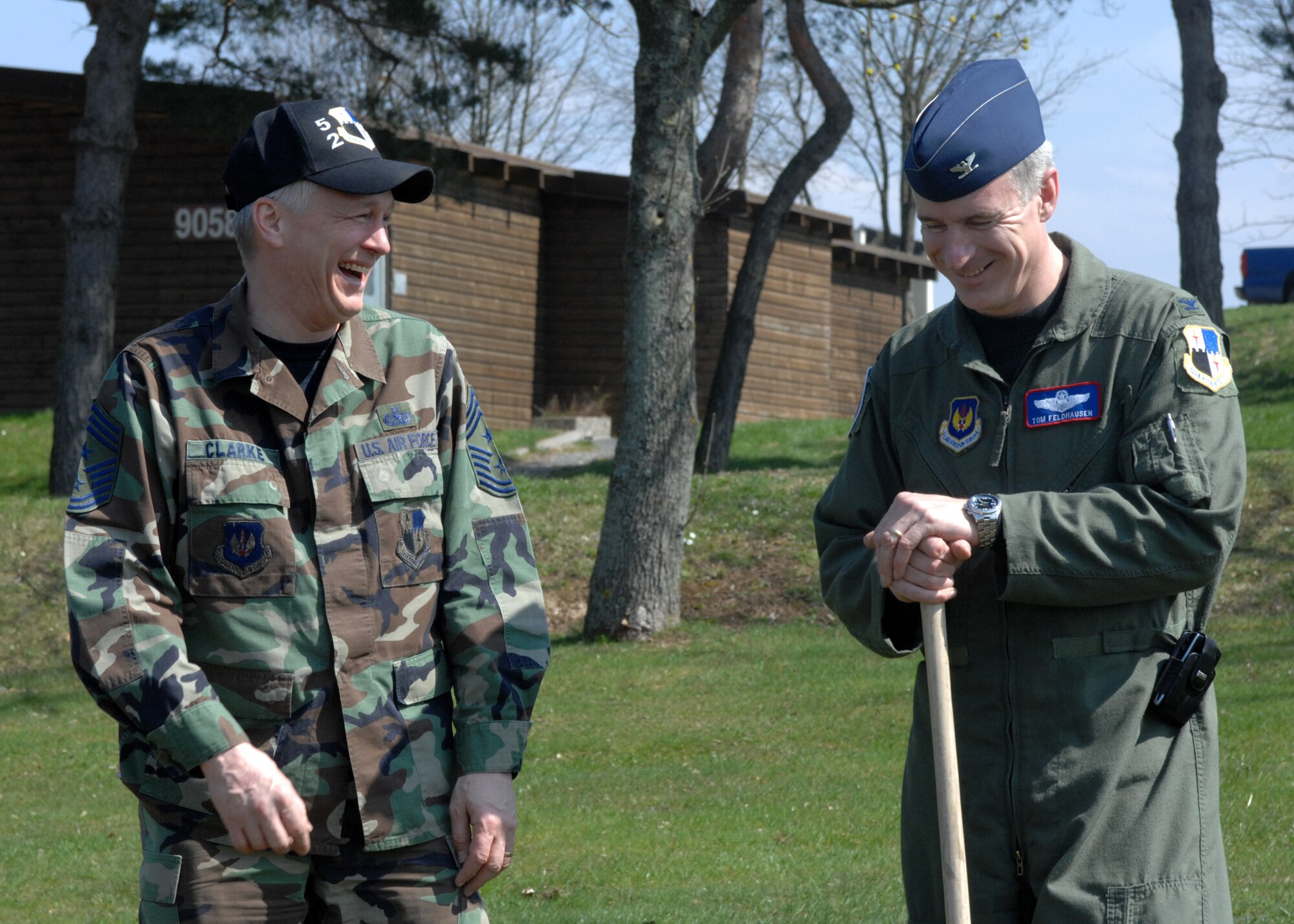 SPANGDAHLEM AIR BASE, Germany -- Col. Thomas Feldhausen, 52nd Fighter Wing commander, and Chief Master Sgt. Vance Clarke, 52nd FW command chief, enjoy the beautiful day after planting trees and shrubberies tree at the Eifel Mountain Golf Course April 18, 2008. Colonel Feldhausen and Chief Clarke planted the trees in honor of Earth Week. (U.S. Air Force Photo/Airman 1st Class Jenifer Calhoun)