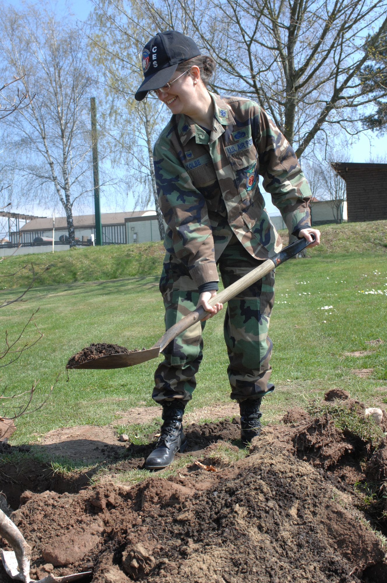 SPANGDAHLEM AIR BASE, Germany – Lt. Col. Kathryn Kolbe, 52nd Civil Engineer Squadron commander, does her part to help the environment by planting a tree at the Eifel Mountain Golf Course April 18, 2008. Various leaders from across Spangdahlem Air Base joined to help beautify the base with various trees and shrubberies in honor of Earth Week. (U.S. Air Force Photo/Airman 1st Class Jenifer Calhoun)