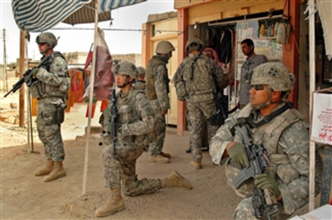 U.S. Army soldiers provide 360-degree security as their platoon leader talks with local market vendors in Mosul, Iraq, April 12, 2008. The soldiers are assigned to 1st Platoon, Company D, 1st Battalion, 8th Infantry Regiment.

