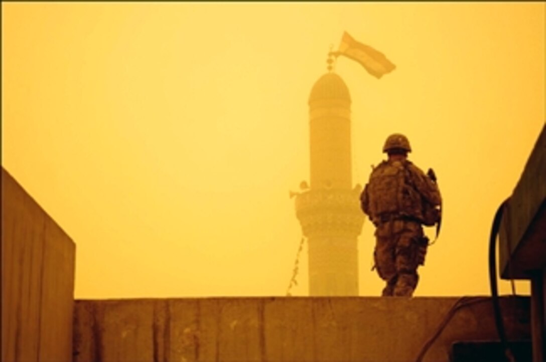 U.S. Army Capt. Will McNutt provides security from a building rooftop as Iraqi soldiers battle armed militia men in the Sadr City District of Baghdad, April 17, 2008. McNutt is assigned to the 10th Mountain Division's 5th Battalion, 25th Field Artillary, 4th Brigade, from Fort Polk, La. 

