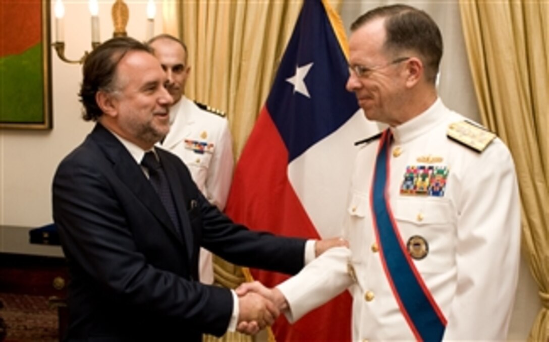 U.S. Navy Adm. Mike Mullen, chairman of the Joint Chiefs of Staff, is congratulated by  Mariano Fernandez, Chilean ambassador to the U.S., after being presented the Chilean Order of Naval Merit, April 21, 2008. The award was presented for outstanding and meritorious distinction for cooperation and support of the Chilean Navy. 