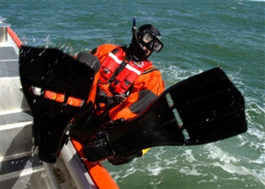 A U.S. Coast Guard aviation survival technician assigned to Coast Guard Air Station Elizabeth City, N.C., conducts a man overboard exercise from a new 45-foot response boat-medium off the coast of Virginia, April 16, 2008. Coast Guard Station Little Creek out of Virginia Beach, Va., is the first Coast Guard unit in the world to receive the new RB-M.