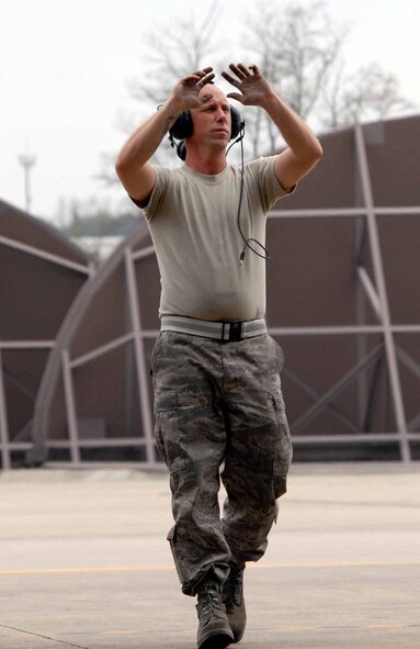 OSAN AIR BASE, Republic of Korea – Staff Sgt. Robert Riley, 51st Aircraft Maintenance Squadron crew chief, marshals out an A-10 Thunderbolt II during the 51st Fighter Wing’s Unit Compliance Inspection April 21. The week-long inspection is to assess the wing’s fundamental compliance and unit mission performance activities that are required by law and governing directives. (U.S. Air Force photo/Staff Sgt. Lakisha Croley)