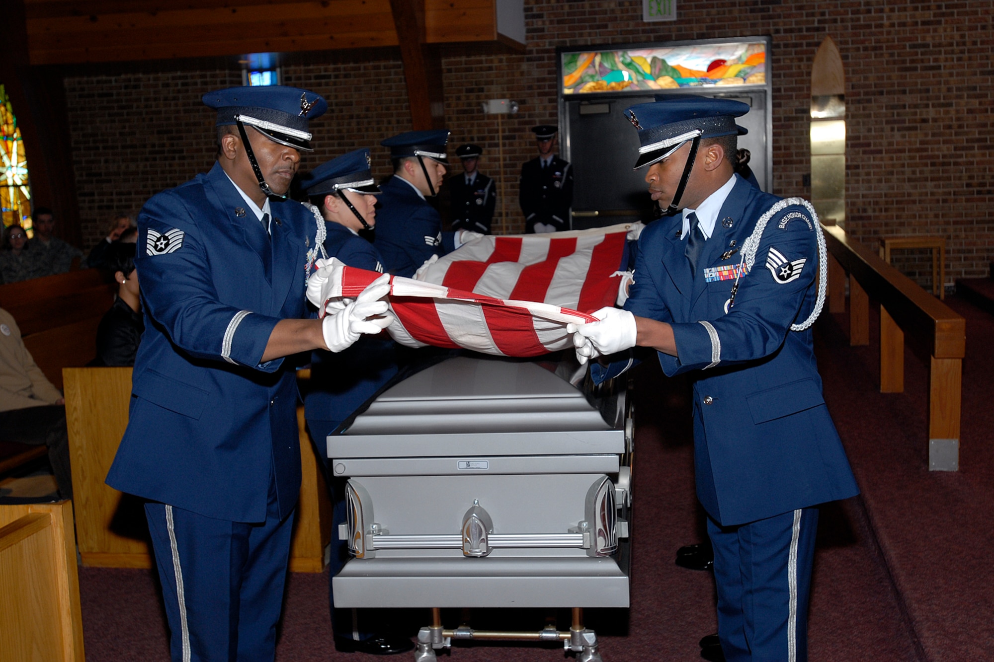 The High Fronter Honor Guard folds the colors, simulating a mock funeral procession for the Air Force-level LeMay inspection team April 10 at the Peterson chapel. The team inspected the 21st Services Squadron April 7-11 to see if they qualified as the “best of the best” of services squadrons throughout the Air Force. (U.S. Air Force photo/Rob Lingley)