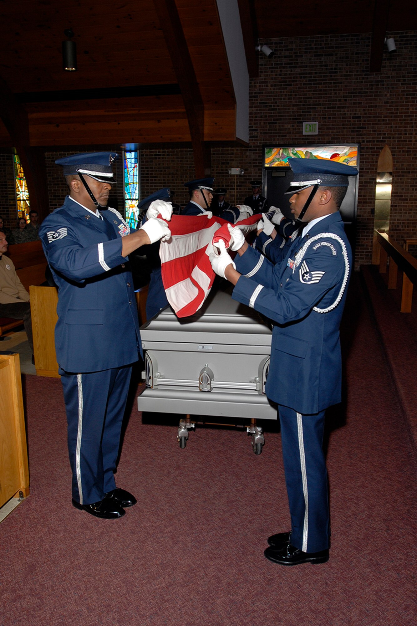 The High Fronter Honor Guard folds the colors, simulating a mock funeral procession for the Air Force-level LeMay inspection team April 10 at the Peterson chapel. The team inspected the 21st Services Squadron April 7-11 to see if they qualified as the “best of the best” of services squadrons throughout the Air Force. (U.S. Air Force photo/Rob Lingley)