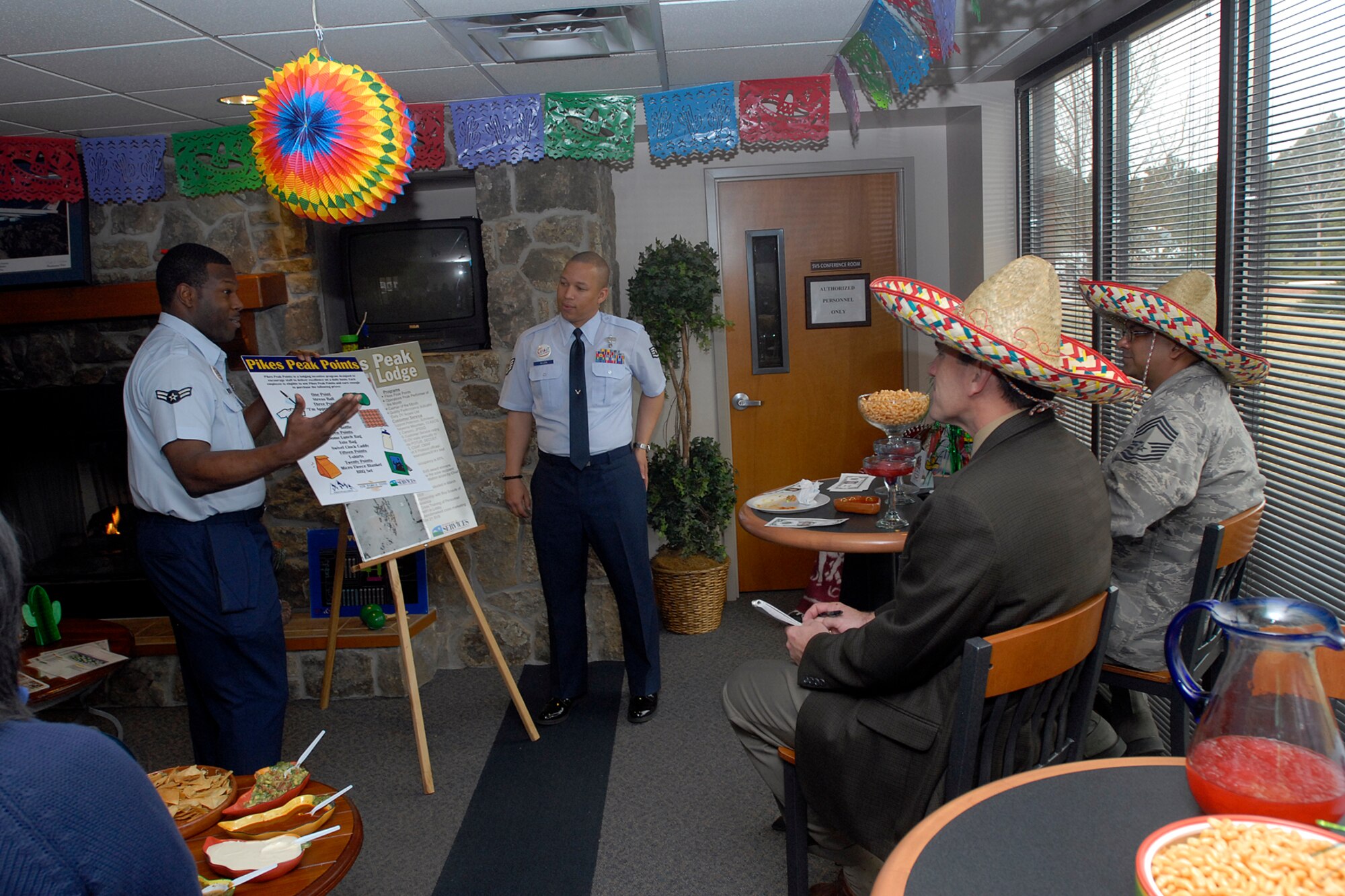 Airman 1st Class Cory Williams, 21st Services Squadron lodging attendant, briefs the Air Force-level LeMay inspection team on the different services provided to guests when they stay at Peterson Air Force Base April 10 on this Colorado base. The team inspected the 21st Services Squadron April 7-11 to see if they qualified as the “best of the best” of services squadrons throughout the Air Force. (U.S. Air Force photo/Larry Hulst)