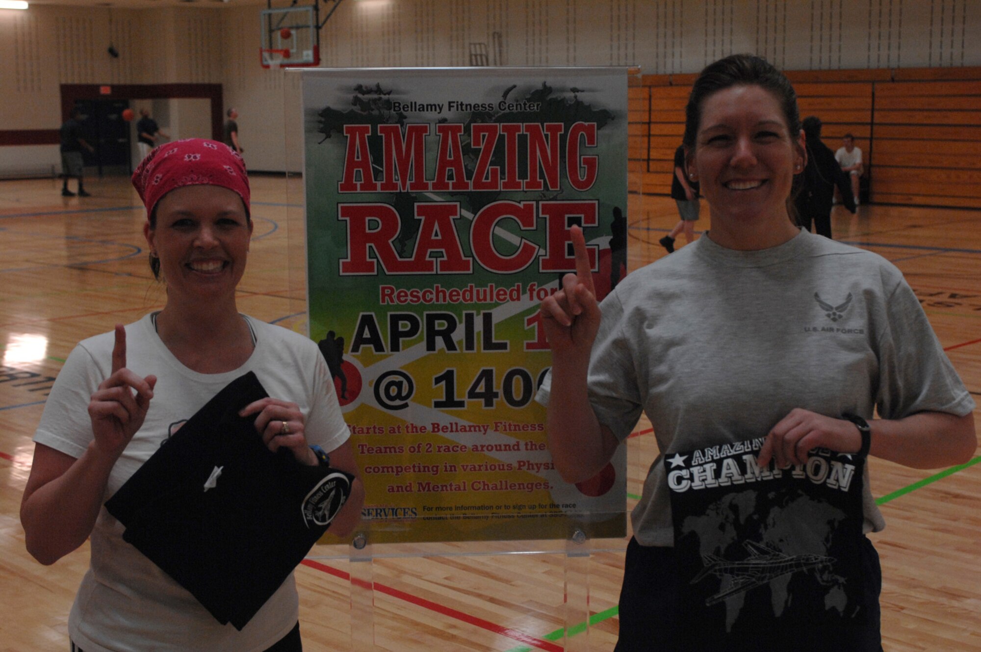 (Left) Jody Cameron and teammate Capt. Amy Nash, 34th Bomb Squadron weapons systems officer, celebrate their victory in the base-wide 2008 Ellsworth Amazing Race April 17. The duo competed against 16 teams and participated in nine mental and physical challenges. (U.S. Air Force photo/ Airman 1st Class Adam Grant)