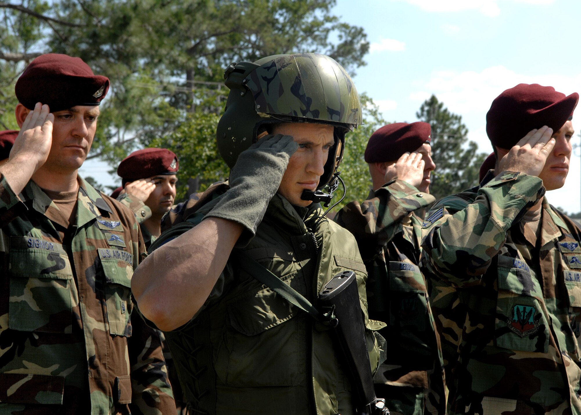 Staff Sgt. Kyle Minshew salutes while in the 'missing man' formation during a Medal of Honor rededication ceremony at Moody Air Force Base, Ga., April 18. Sergeant Minshew was portraying the role of Airman 1st Class William H. Pitsenbarger, a Medal of Honor recipient. The ceremony was held in honor of Airman Pitsenbarger for his selfless and heroic acts during the Vietnam war that lead to his death on April 11, 1966. Sergeant Minshew is a 38th Rescue Squadron pararescueman. (U.S. Air Force photo/Airman 1st Class Brittany Barker) 