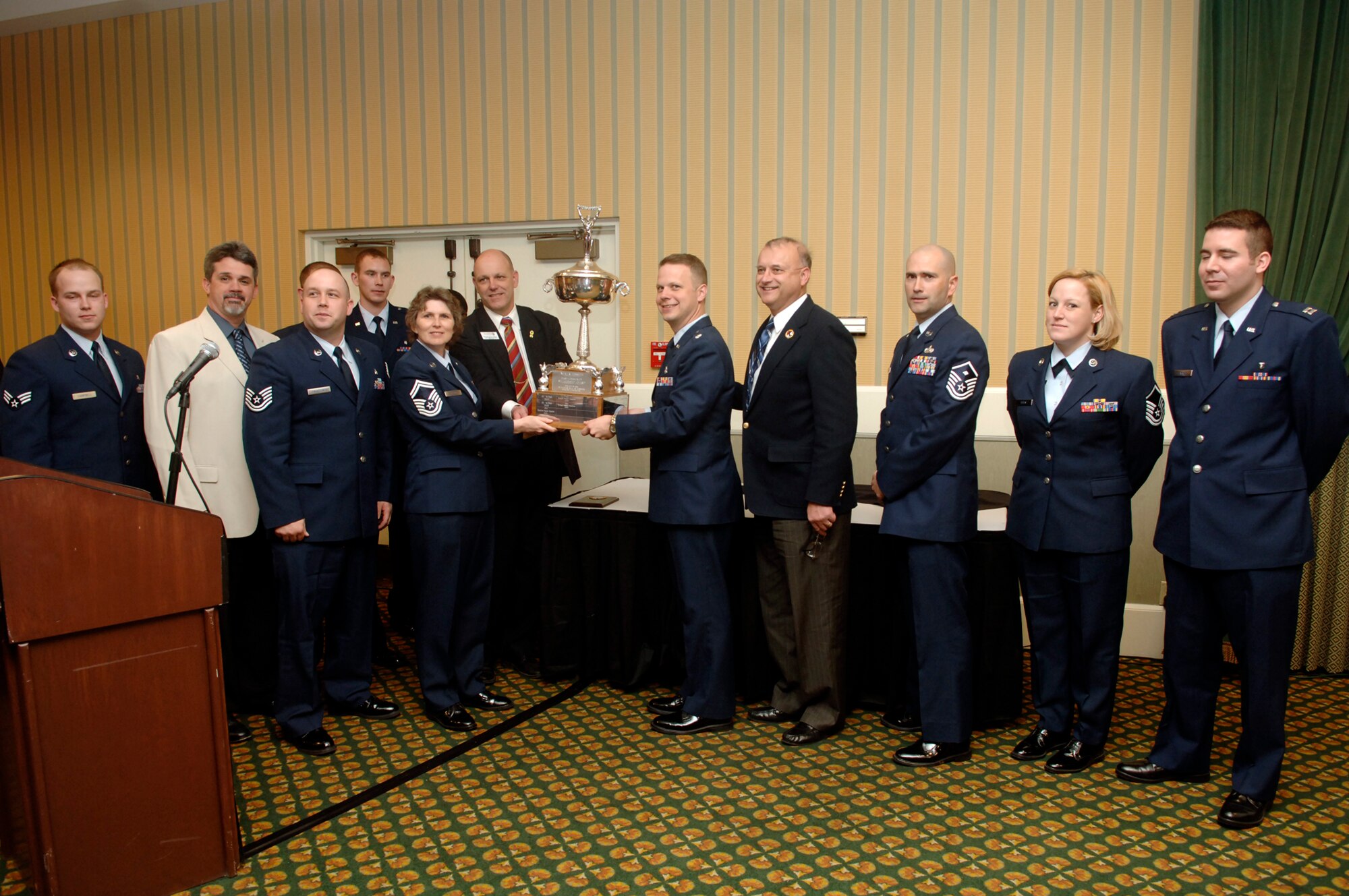 FAIRCHILD AIR FORCE BASE, Wash. – Members of the 92nd Medical Support Squadron accept the Neal Fosseen Trophy at the 2008 Armed Forces Person of the Year awards ceremony held at the Red Lion Hotel in downtown Spokane on April 17. (U.S. Air Force photo / Senior Airman Chad Watkins)