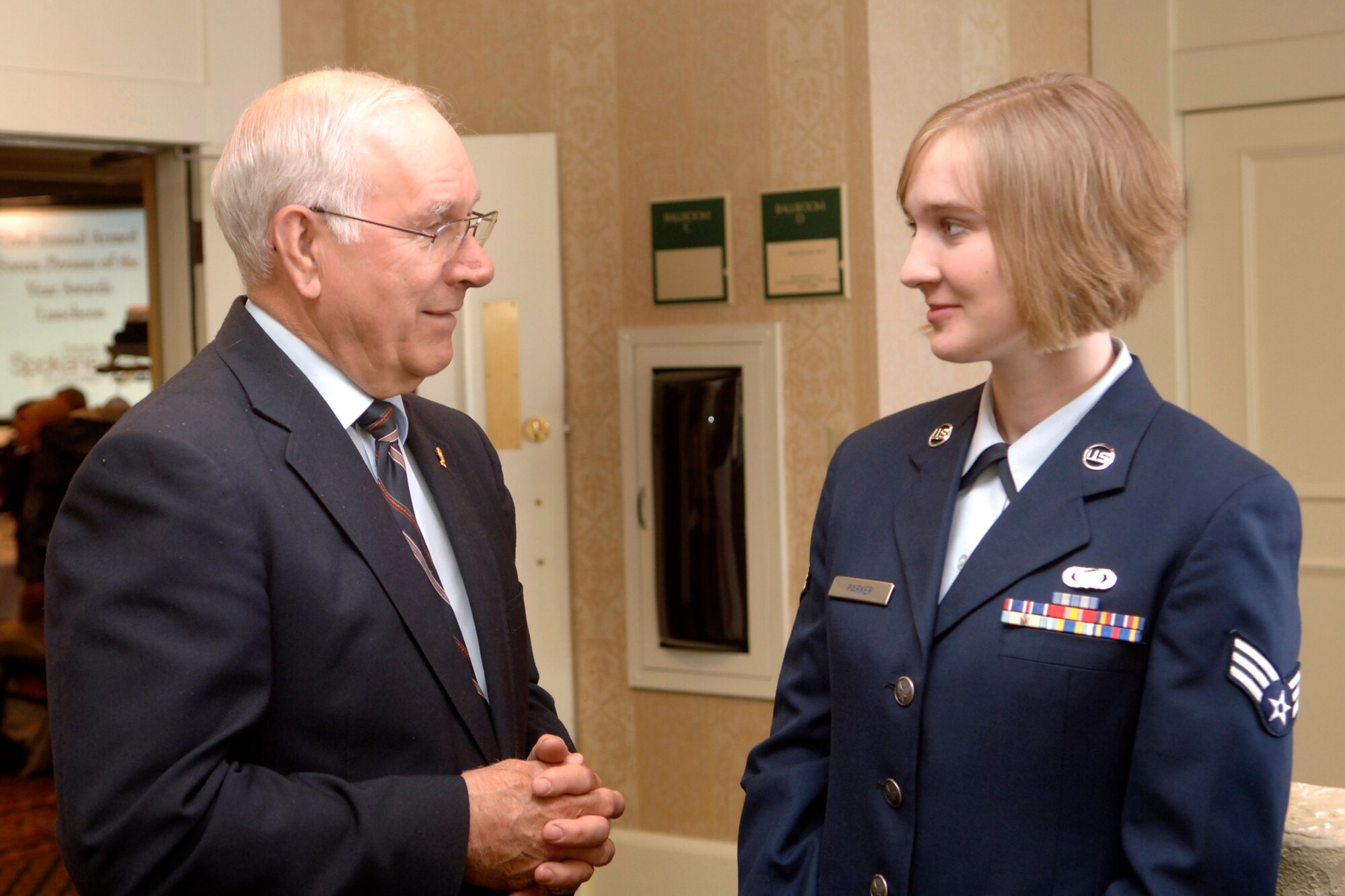 FAIRCHILD AIR FORCE BASE, Wash. – Eighth Chief Master Sgt. of the Air Force Sam Parrish congratulates Senior Airman Mikaela Parker, 92nd Security Forces Squadron, on her nomination for the 2008 Armed Forces Person of the Year at the Red Lion Hotel in downtown Spokane on April 17.  Airman Parker was nominated in the Reserve/Guard Junior Enlisted category by the 141st Air Refueling Wing, but is currently activated full time with the 92nd SFS. (U.S. Air Force photo / Senior Airman Chad Watkins)