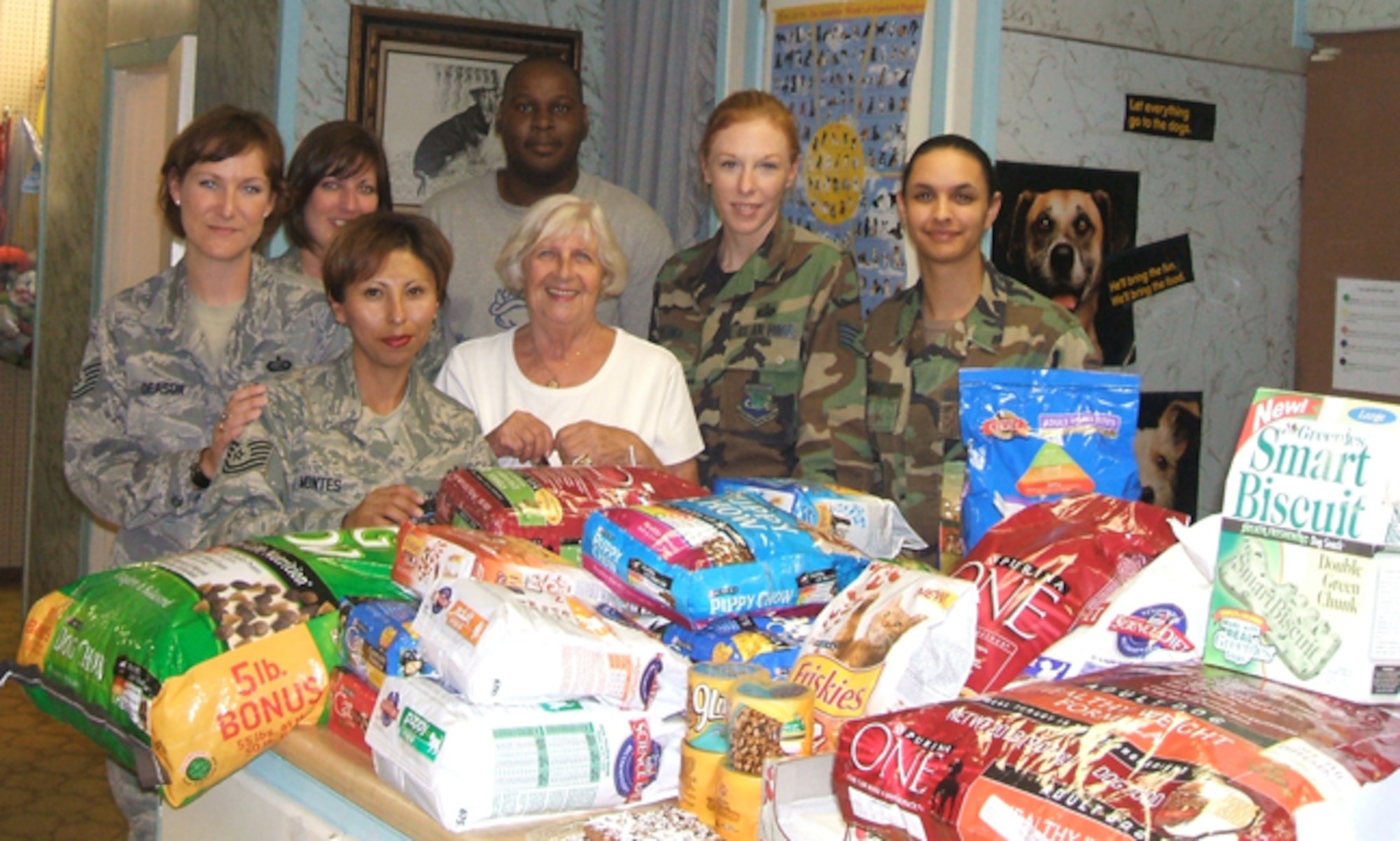 Members of the Air Force Personnel Center Junior Enlisted Council show off some of the donations raised recently to support the Universal City Animal Shelter. The council raised 756 pounds of food, 224 pounds of cat litter, 16 pounds of treats and $155. From left, front row, are Tech. Sgt. Sara Montes and Aina Blake; back row, Tech. Sgt. Sandra Deason, Staff Sgt. Tonya Posey, Sharod White, Staff Sgt. Simona Patrick and Senior Airman Janina-Eva White. (U.S. Air Force photo/File)