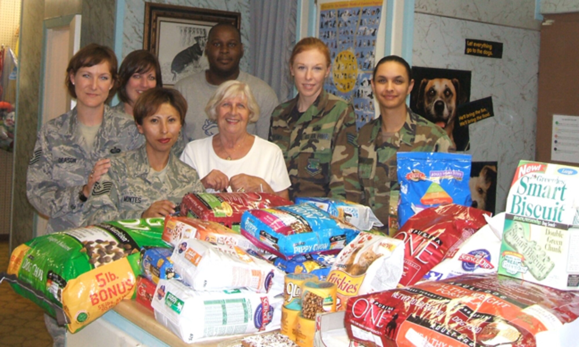 Members of the Air Force Personnel Center Junior Enlisted Council show off some of the donations raised recently to support the Universal City Animal Shelter. The council raised 756 pounds of food, 224 pounds of cat litter, 16 pounds of treats and $155. From left, front row, are Tech. Sgt. Sara Montes and Aina Blake; back row, Tech. Sgt. Sandra Deason, Staff Sgt. Tonya Posey, Sharod White, Staff Sgt. Simona Patrick and Senior Airman Janina-Eva White. (U.S. Air Force photo/File)