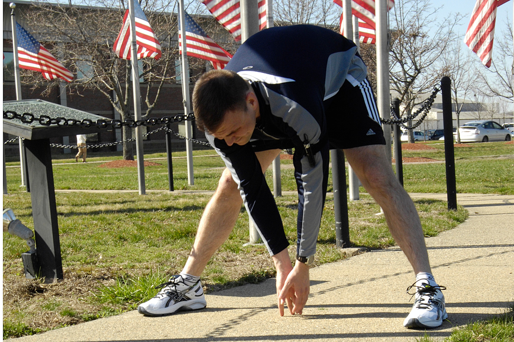 HANSCOM AFB, Mass. – Capt. Brad Panton, Program Manager for the Enhanced Regional Situation Awareness Program here, stretches out before a short run April 17th in preparation for the upcoming Boston Marathon. Capt. Panton ran the marathon with his two siblings, Army Capt. Jeannie Deakyne and Navy Lt. Davie Panton. (U.S. Air Force photo by Linda LaBonte Britt.)