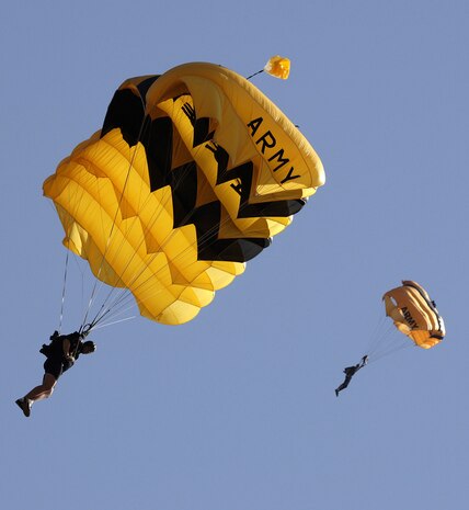 Two Army Soldiers from the Golden Knights Parachute Team come down underneath their parachute canopy at the Military World Games in Hyderabad, India, Oct. 14, 2007. The Golden Knights will perform at the 2008 ?Wings Over Charleston? Air Expo. (U. S. Air Force photo/Master Sgt. Glenda Lynchard
