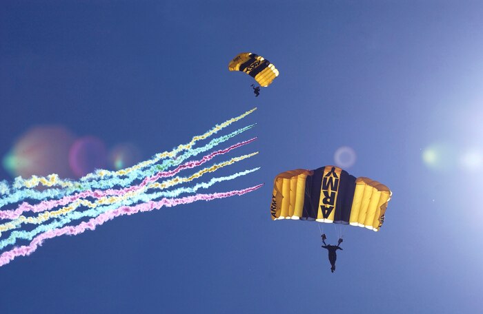 The Army Golden Knights perform an aerobatic routine in the skies over Mountain Home AFB, Idaho, Sept. 13, 2003. The Golden Knights Parachute Team enables the Army to reach out to influential citizens and give them a taste of professionalism, leadership and teamwork involved with the military. (U.S. Air Force photo/Staff Sgt. Bennie Davis III)