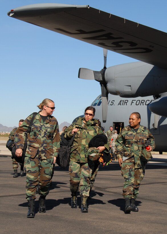Staff Sgt. Monica Roschek, Senior Amn. Kim Vinson, and Staff Sgt. Diana Matthews, services specialists with the 149th Fighter Wing, Texas Air National Guard, San Antonio, Texas, arrive at Davis-Monthan Air Force Base in Tucson, Arizona on April 13, 2008. The 149th is deployed to Arizona to participate in Coronet Cactus, an annual 149th training exercise. (Air National Guard photo by Staff Sgt. Andre Bullard)(RELEASED)