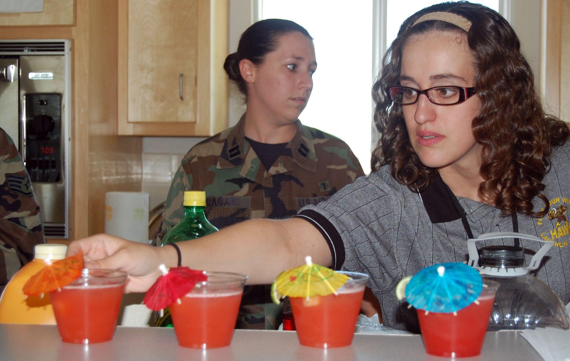 LAUGHLIN AIR FORCE BASE, Texas—Grisel Sanchez, 47th Aeromedical Dental Squadron, serves non-alcoholic beverages to Laughlin members during a gathering in support of Alcohol Awareness Month at Su Casa here April 17.  The Health and Wellness Center, in conjunction with the Mental Health Flight, sponsored the event to provide refreshing alternatives to alcoholic drinks. (U.S. Air Force photo by 2nd Lt. Courtney Kippenberger)  