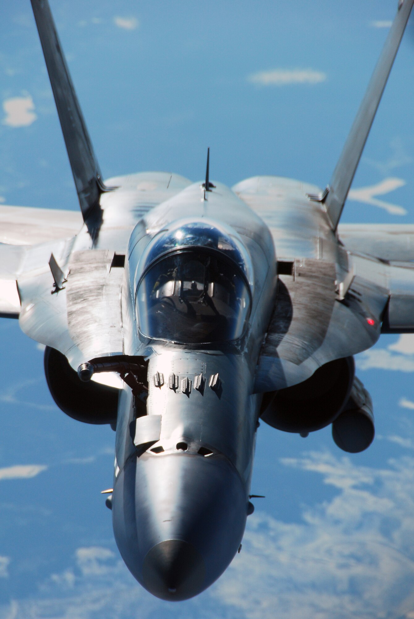 A Royal Australian Air Force F/A-18 Hornet breaks away after refueling behind a KC-10 Extender April 17, 2008, at Eielson Air Force Base, Alaska. Red Flag-Alaska 08-2 is a series of Pacific Air Forces field training exercises for U.S Forces and allies that provide joint offensive counter-air, indirection, close air support, and large force employment training in a simulated combat environment. (U.S. Air Force Photo/Airman 1st Class Jonathan Snyder)