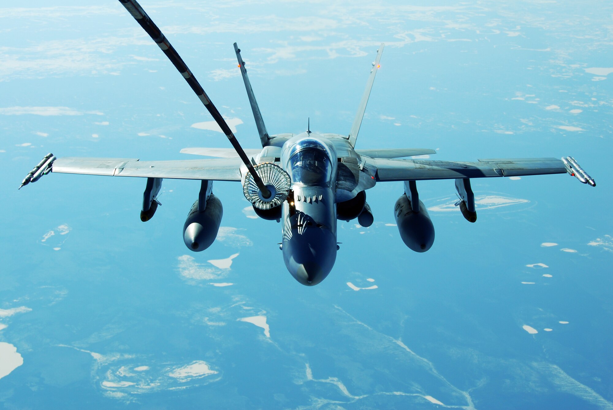 A Royal Australian Air Force F/A-18 Hornet refuels using behind a KC-10 Extender while at 26,000 feet April 17, 2008, at Eielson Air Force Base, Alaska. RED FLAG-Alaska 08-2 is a series of Pacific Air Forces field training exercises for U.S Forces and allies that provides joint offensive counter-air, indirection, close air support, and large force employment training in a simulated combat environment. (U.S. Air Force Photo/Airman 1st Class Jonathan Snyder)
