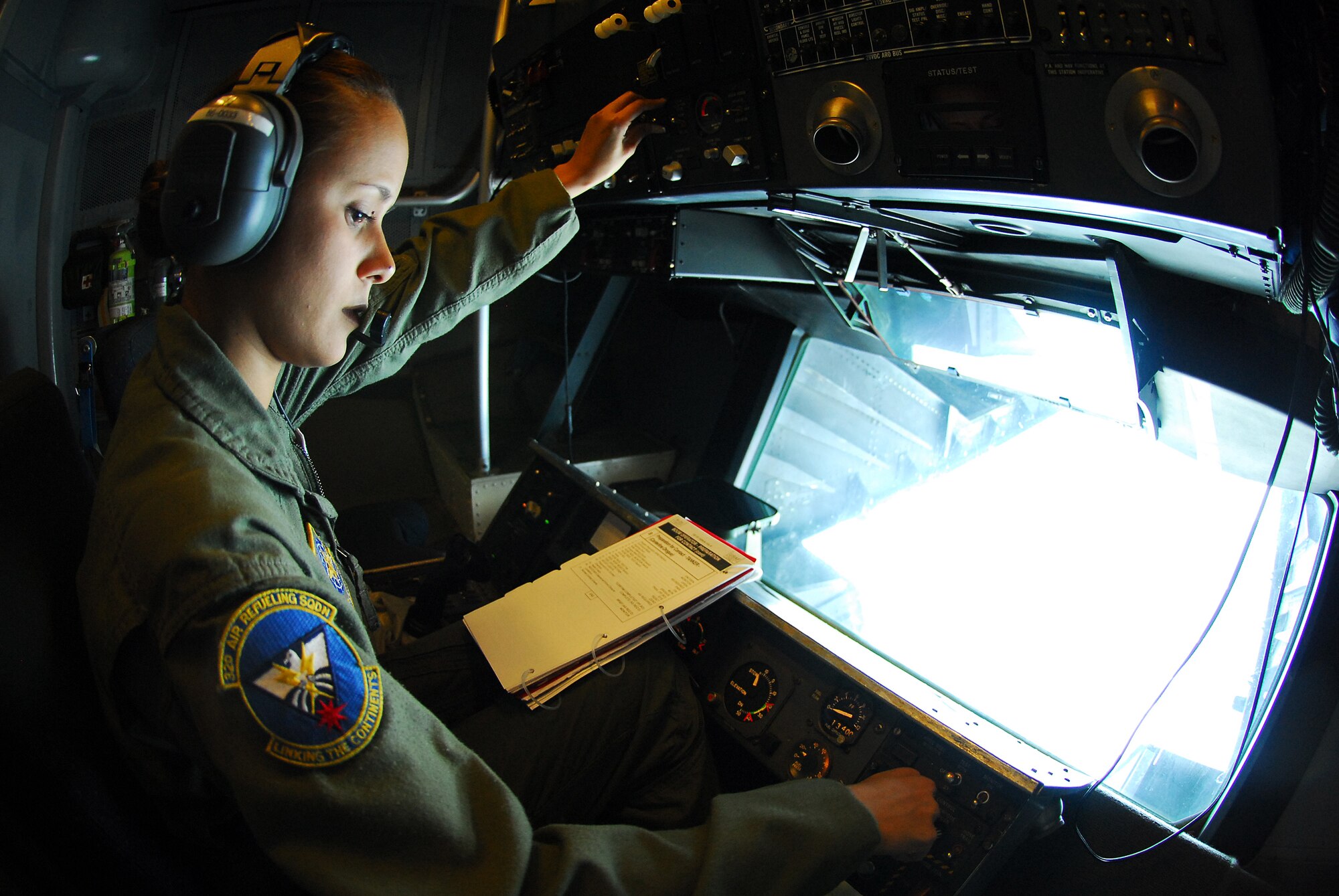 Senior Airman Debbie Villanueva goes through the check list procedures to lower the boom on a KC-10 Extender April 17, 2008, at Eielson Air Force Base, Alaska. RED FLAG-Alaska 08-2 is a series of Pacific Air Forces field training exercises for U.S Forces and allies that provide joint offensive counter-air, indirection, close air support, and large force employment training in a simulated combat environment. Airman Villanueva is a boom operator assigned to the 32nd Air Refueling Squadron from McGuire Air Force Base, N.J. (U.S. Air Force Photo/Airman 1st Class Jonathan Snyder)