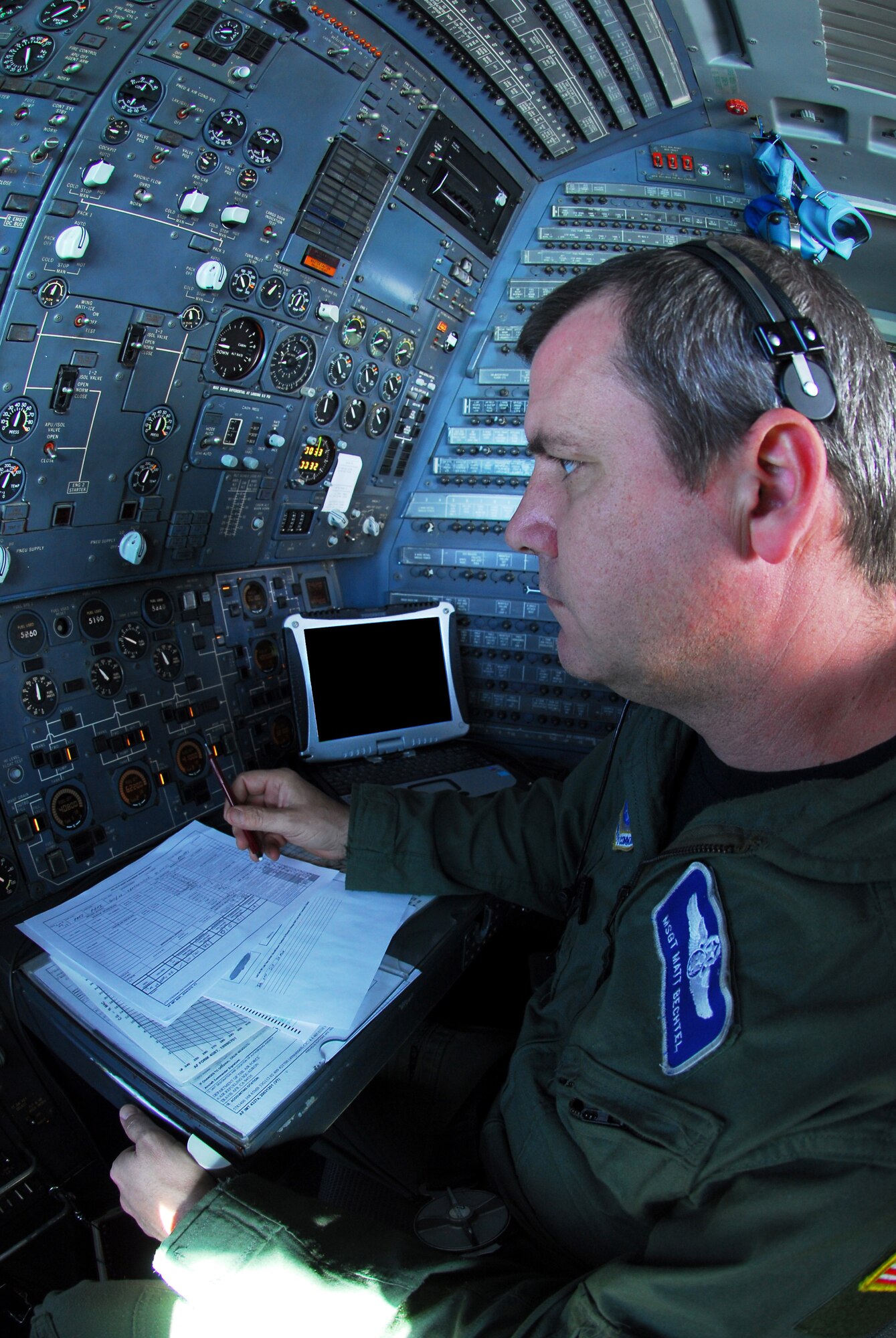 Master Sgt. Matt Bechtel monitors gauges on a KC-10 Extender while in flight April 17, 2008, at Eielson Air Force Base, Alaska. RED FLAG-Alaska 08-2 is a series of Pacific Air Forces field training exercises for U.S Forces and allies that provides joint offensive counter-air, indirection, close air support, and large force employment training in a simulated combat environment. Sergeant Bechtel is a boom operator assigned to the 32nd Air Refueling Squadron from McGuire Air Force Base, N.J. (U.S. Air Force Photo/Airman 1st Class Jonathan Snyder)