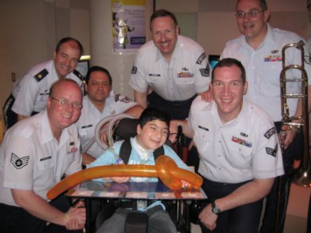 Alaska Brass pictured here with Adam,  who is a big fan of Spiderman and the Pirates of the Caribbean movies.  AB performed arrangements of some of his and other children's favorite movie music at the Children's Hospital in Syndey, Australia