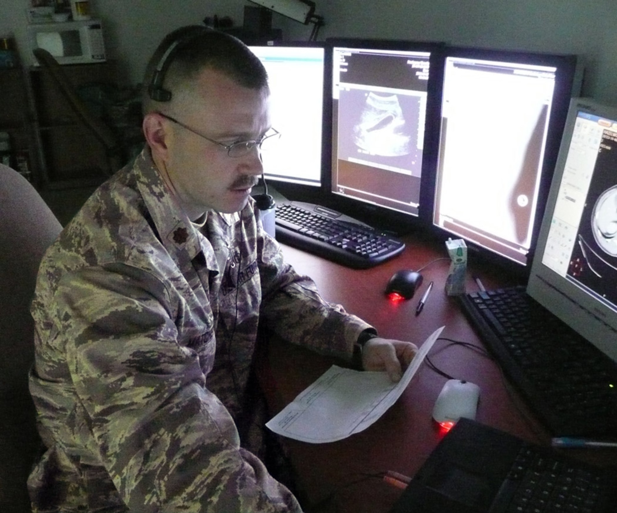 Maj. Michael Matchette, an Air Force radiologist at the Air Force Theater Hospital at Balad Air Base, Iraq, uses voice recognition software to quickly dictate his radiology readings electronically into the Medical Communications for Combat Casualty Care, or MC4, system. (U.S. Air Force photo)