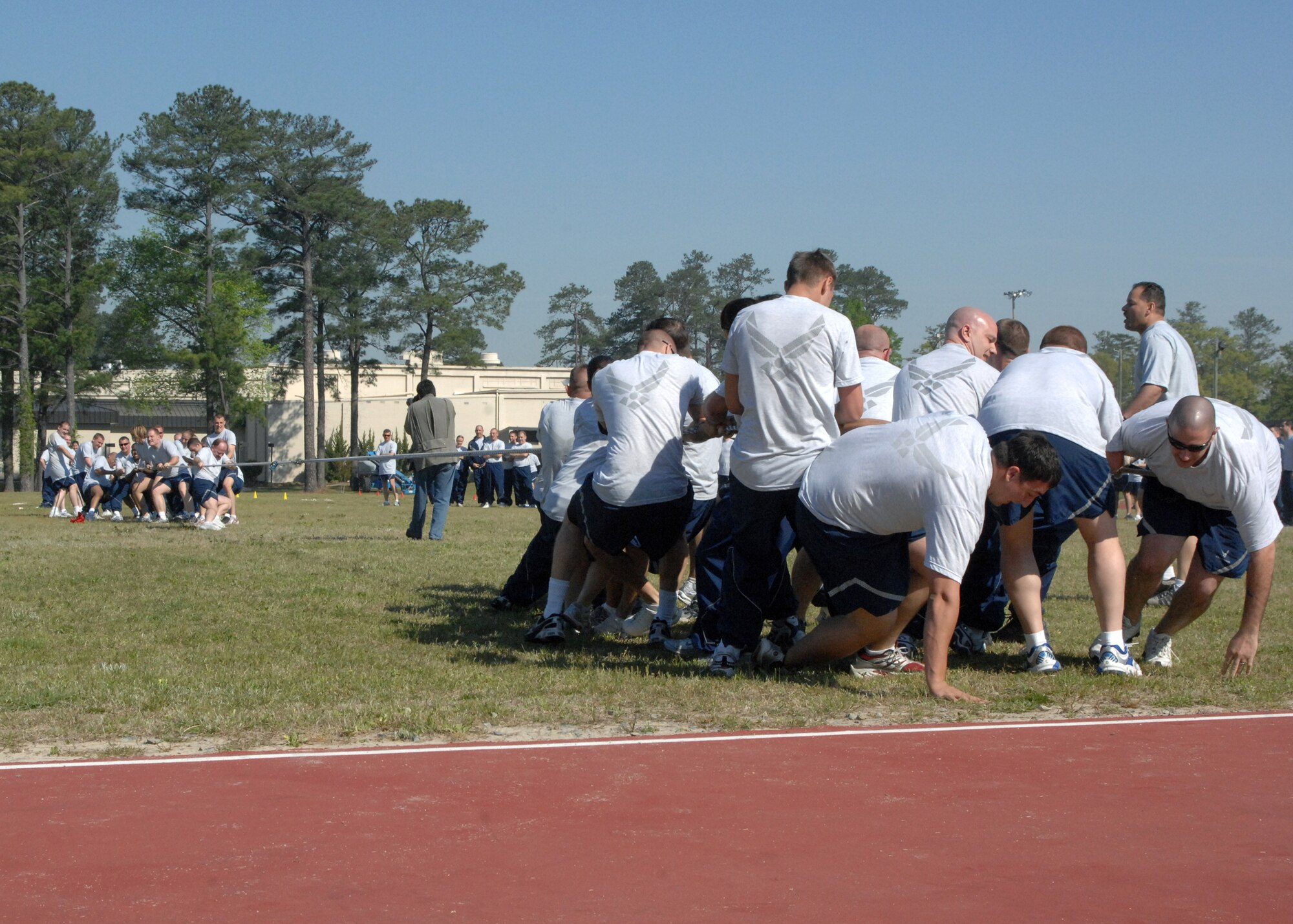 SEYMOUR JOHNSON AIR FORCE BASE, N.C. - Members of the 4th Fighter Wing, compete in a tug-o-war during Wingman Warrior Day on April 18. Wingman Warrior Day brings together Airmen of the 4th Fighter Wing to forge mind, body and soul with lifeskill classes, sports events and skills training. (U.S. Air Force photo by Airman First Class Jonathon Williams)