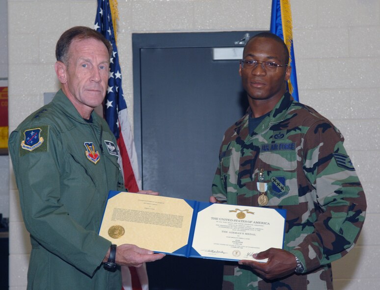 DYESS AIR FORCE BASE, Texas -- Lt. Gen. Norman Seip, 12th Air Force commander, presents the Airman's Medal to Staff Sgt. Terral Leak, 7th Civil Engineer Squadron. Sergeant Leak received the medal for his heroic actions while stationed in Japan two years ago.  He had noticed that an apartment had caught on fire, and while the fire could have injured him seriously he ensured that every person was evacuated safely from the building. (U.S. Air Force photo by Airman 1st Class Micheal Breaux)