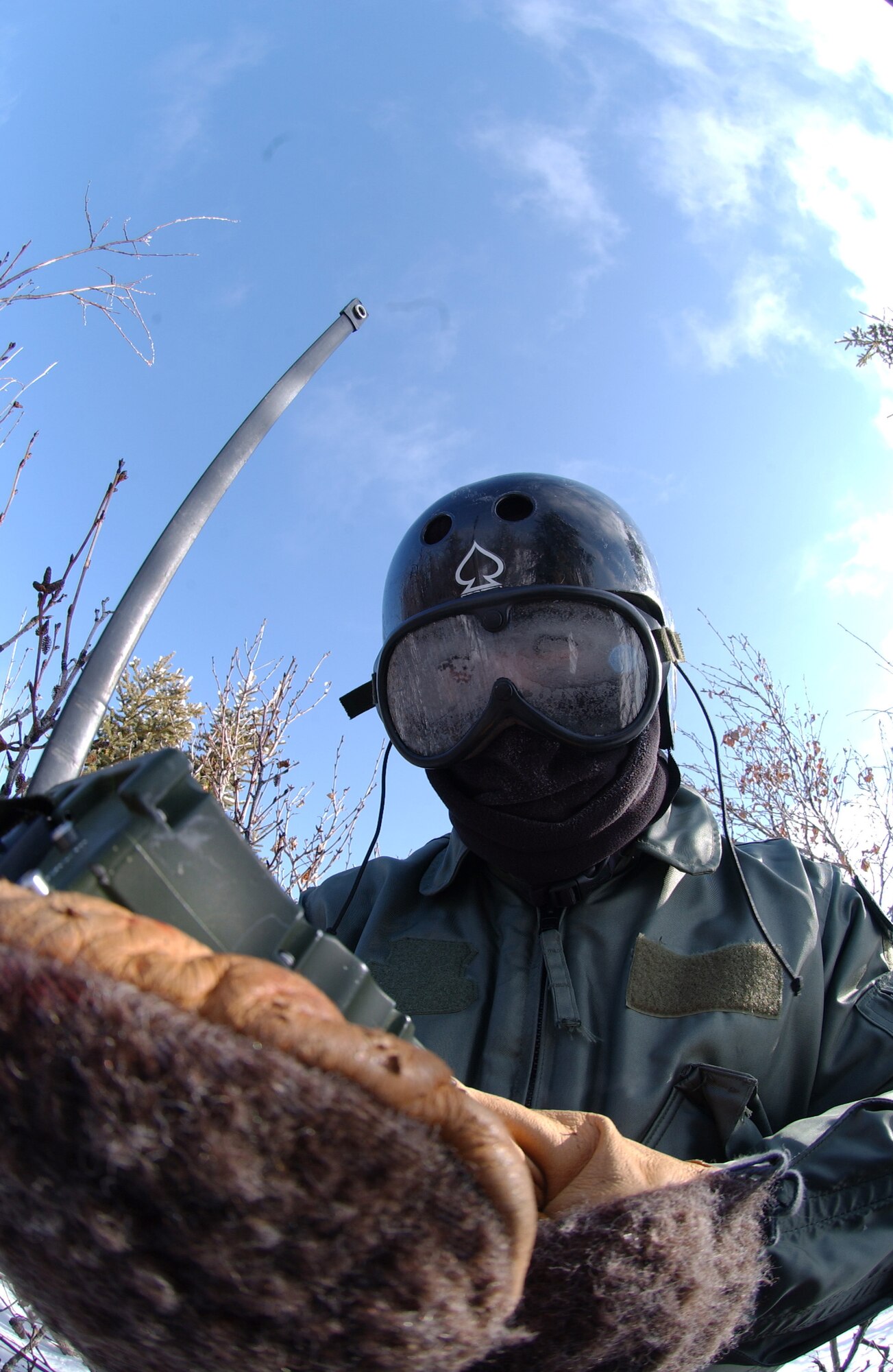 1st Lt. Alex Goldberg uses a PRC-112 radio to communicate with 33rd Rescue Squadron crew while employing his evasion and survival training during RED
FLAG-Alaska 08-2 April 16, 2008, at Eielson Air Force Base, Alaska. Lieutenant Goldberg is simulating as a downed pilot behind enemy lines and must communicate with the 33rd RQS for extraction. Lieutenant Goldberg is a pilot of the 61st Fighter Squadron from Luke Air Force Base, Ariz. (U.S. Air Force Photo/Airman 1st Class Jonathan Snyder)