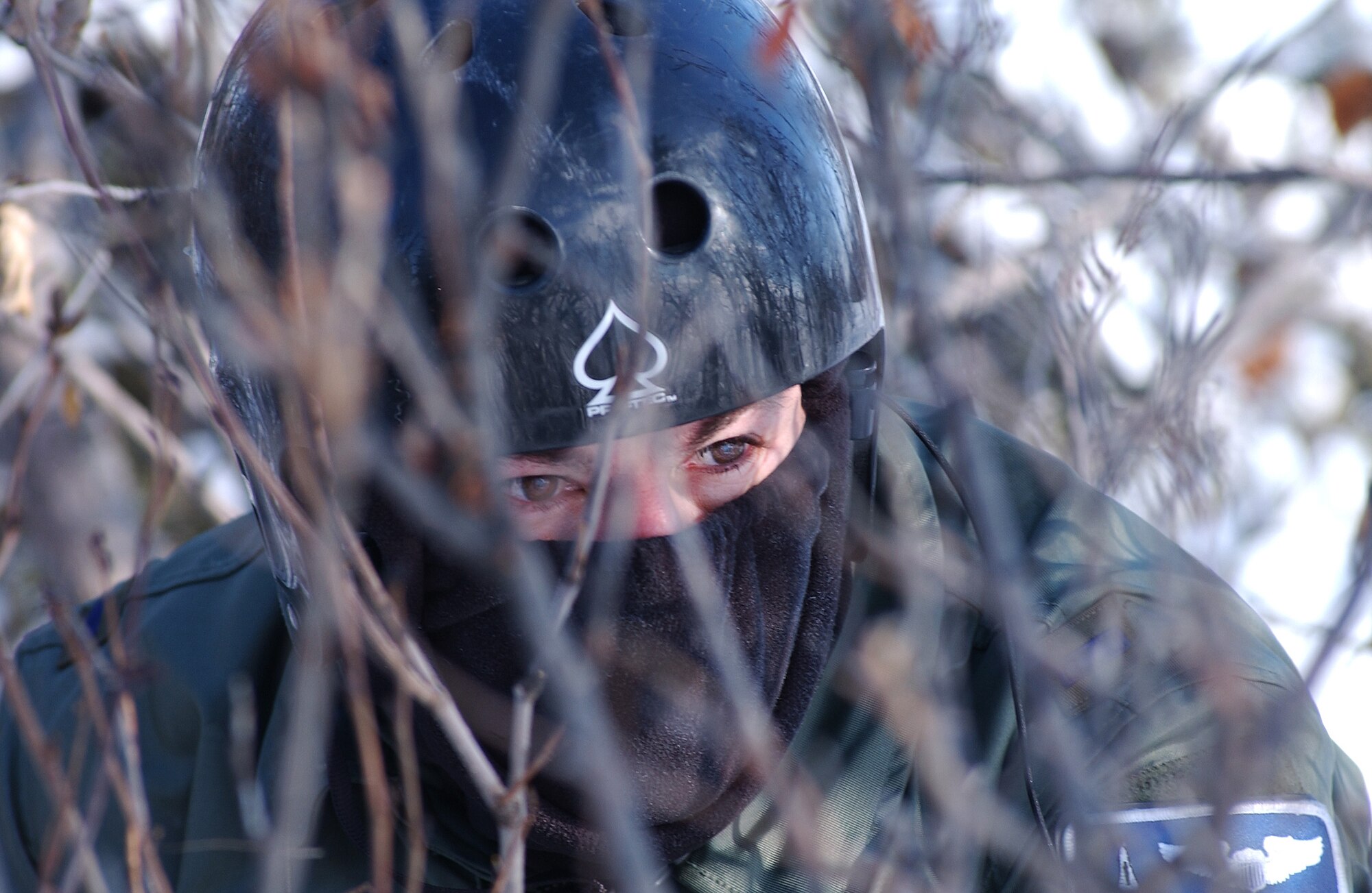 1st Lt. Alex Goldberg finds cover in a small patch of brush and trees while employing his evasion and survival training during RED FLAG-Alaska 08-2 April 16, 2008, at Eielson Air Force Base, Alaska. Lieutenant Goldberg is simulating as a downed pilot behind enemy lines and must communicate with the 33rd Rescue Squadron for extraction. Lieutenant Goldberg is a pilot of the 61st Fighter Squadron from Luke Air Force Base, Ariz. (U.S. Air Force Photo/Airman 1st Class Jonathan Snyder)