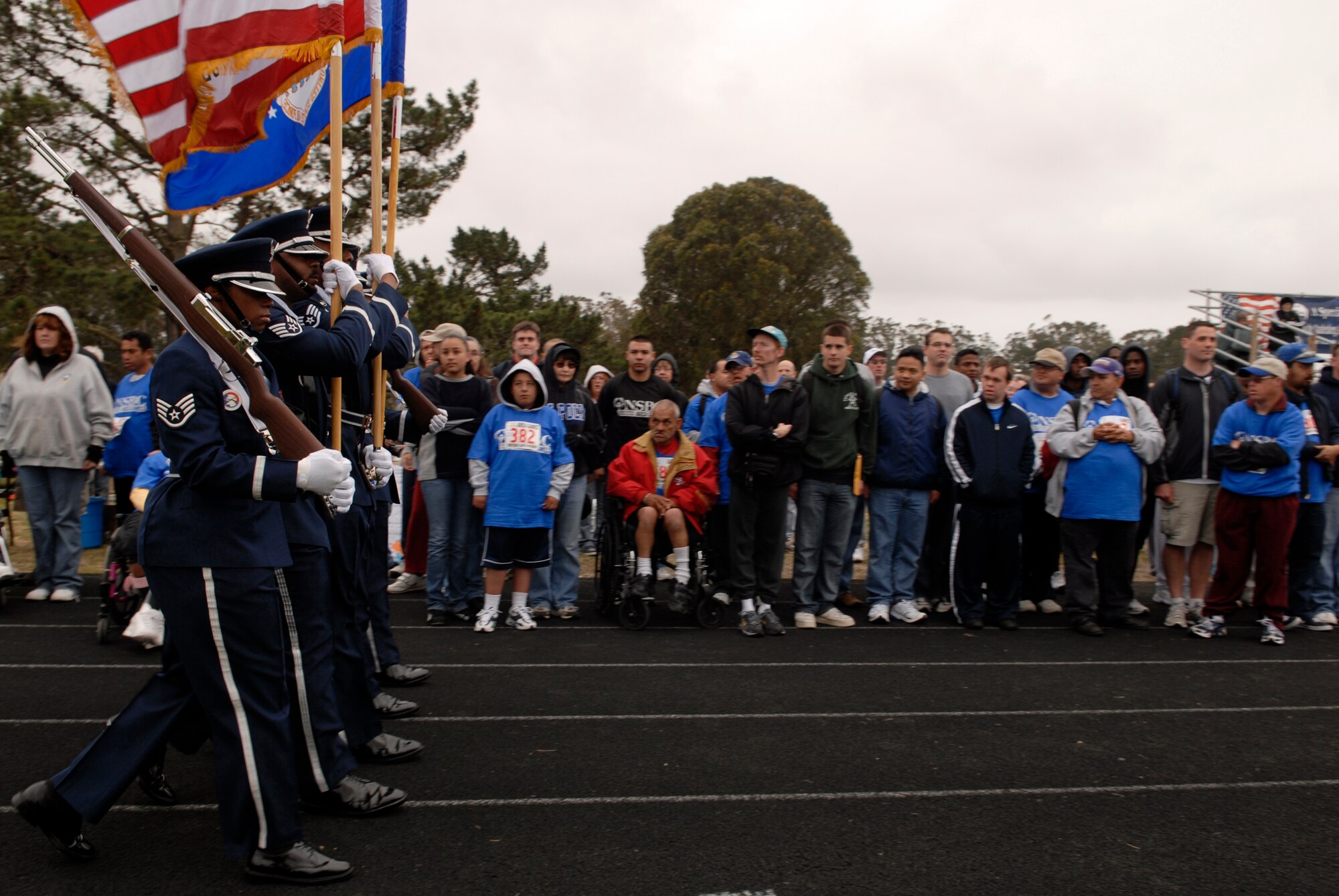 VANDENBERG AIR FORCE BASE, Calif. -- The Vandenberg Honor Guard march before the crowd during the opening ceremonies of the Special Olympics here April 19, 2008. Vandenberg is scheduled to host the 2009 Special Olympics Harry Wood Area Games presented by Northern Santa Barbara County at 9 a.m. April 25 at the base track here. (U.S. Air Force photo/Airman 1st Class Christian Thomas) 
