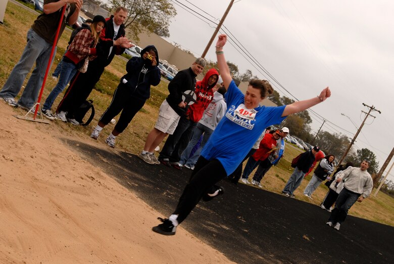 VANDENBERG AIR FORCE BASE, Calif. -- A young woman completes a long jump during the Special Olympics here April 19. (U.S. Air Force photo/Airman 1st Class Christian Thomas) 
