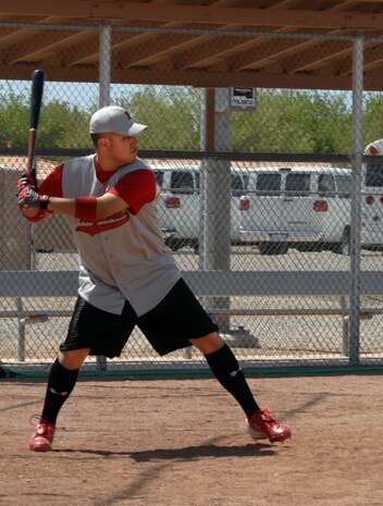 NELLIS AIR FORCE BASE, Nev. -- Staff Sgt. Jaime Velasquez III, 99th Medical Operations Squadron medical technician and the Nellis Raptors’ coach, is about to swing high at a practice game at the Area 3 baseball field here April 6. He has been coaching for about 10 years now and is leading his team to victory week after week. (Air Force photo by Senior Airman Nadine Barclay)