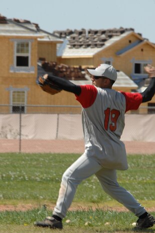 NELLIS AIR FORCE BASE, Nev. -- Staff Sgt. Mark Lopez, 99th Medical Support Squadron biomedical equipment technician and the Nellis Raptors’ centerfield player, is hurling the ball infield at a team practice at the Area 3 baseball field here April 6. The winning team practices exclusively after duty hours and on the weekends. (Air Force photo by Senior Airman Nadine Barclay)