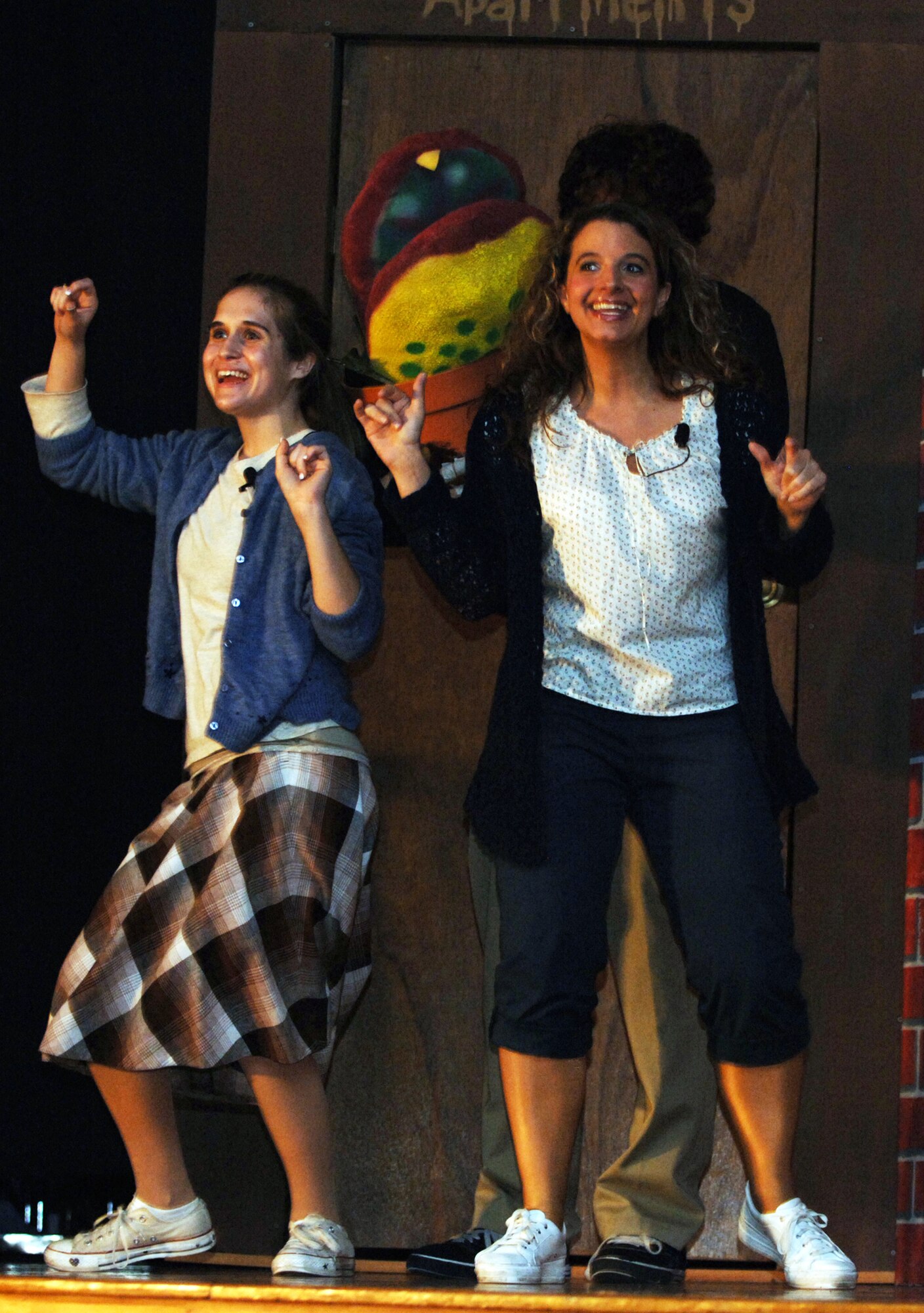 Tech. Sgt. Miranda "Mindy" Whiting (on right) "had a blast" performing in musicals through high school before joining the Air Force.  Sergeant Whiting, a Reserve and civilian flight scheduler for the 18th Air Refueling Squadron, returns to the stage this week as the singing street tough Ronette in "Little Shop of Horrors" at McConnell Air Force Base, Kan. (photo by Tech. Sgt. Jason Schaap)