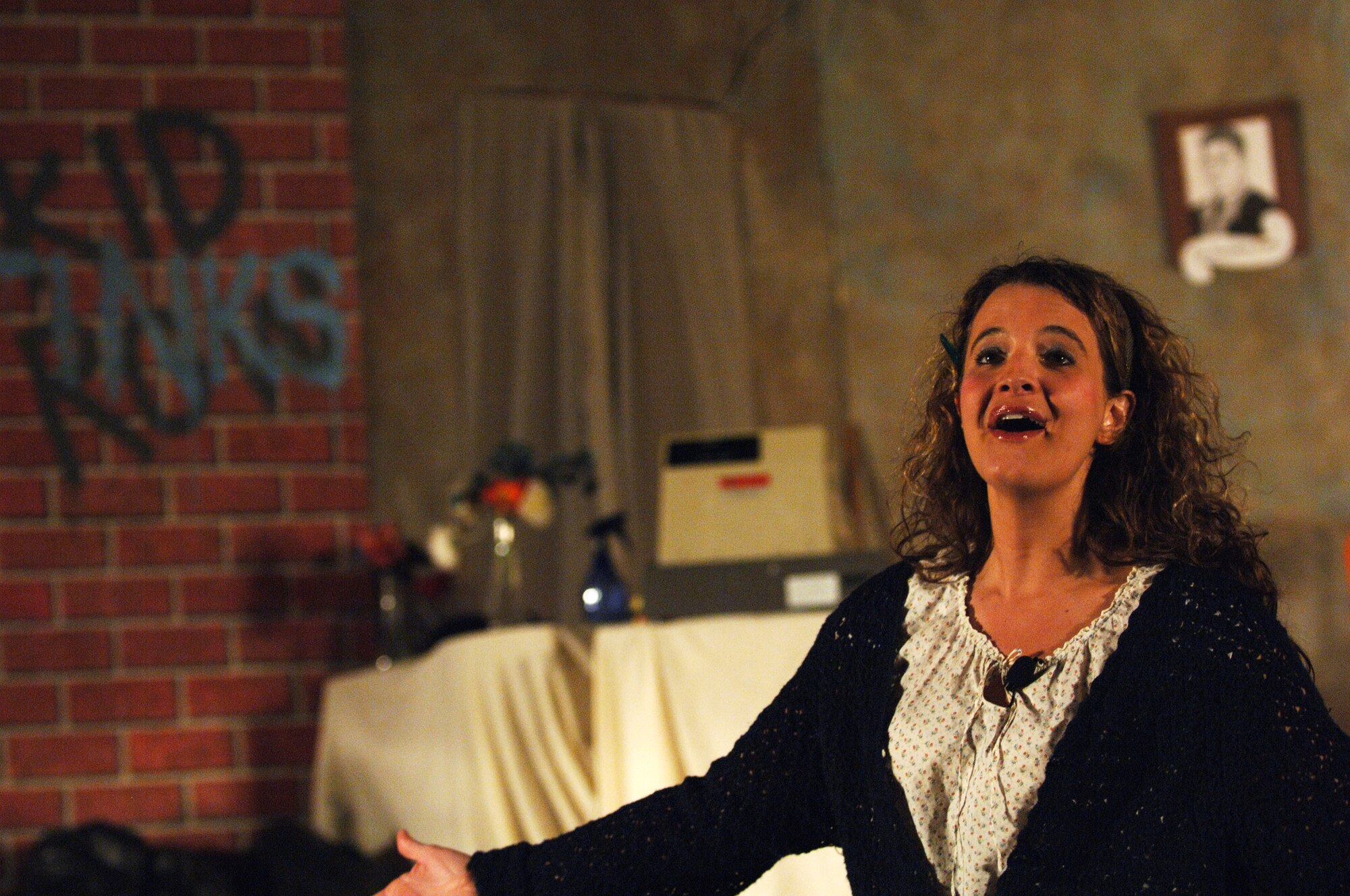 Tech. Sgt. Miranda "Mindy" Whiting "had a blast" performing in musicals through high school before joining the Air Force.  Sergeant Whiting, a Reserve and civilian flight scheduler for the 18th Air Refueling Squadron, returns to the stage this week as the singing street tough Ronette in "Little Shop of Horrors" at McConnell Air Force Base, Kan. (photo by Tech. Sgt. Jason Schaap)