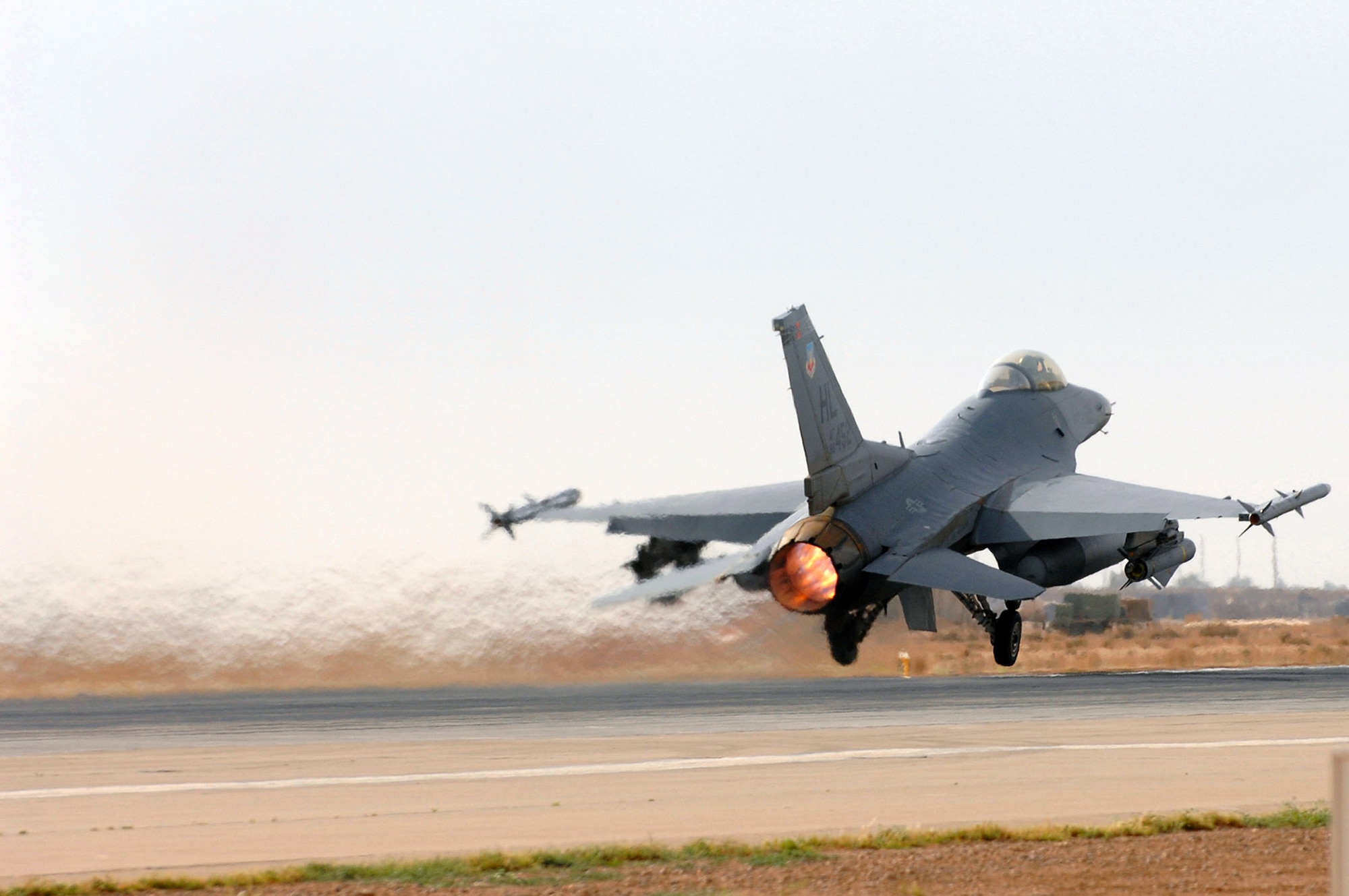 An F-16 Fighting Falcon from Hill Air Force Base, Utah, takes off from Balad Air Base, Iraq, April 19. The F-16 pilots provide close-air support to Army ground units by identifying improvised explosive devices and emplacers in the area. (U.S. Air Force photo/Senior Airman Julianne Showalter) 
