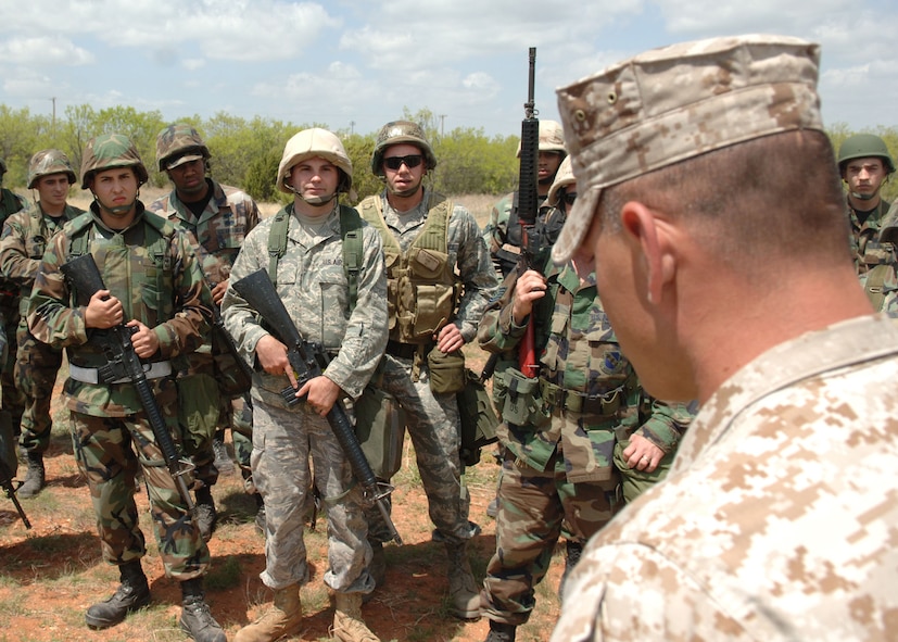 DYESS AIR FORCE BASE, Texas -- Marine Staff Sergeant Pablo Torrez briefs a group of Dyess Airmen on convoy simulation April 17. Sergeant Torrez, with the help of his fellow Marines, properly insructed the Airmen on correct techniques to engage in hostile convoy situations. (U.S. Air Force Photo by Airman 1st Class Micheal Breaux)