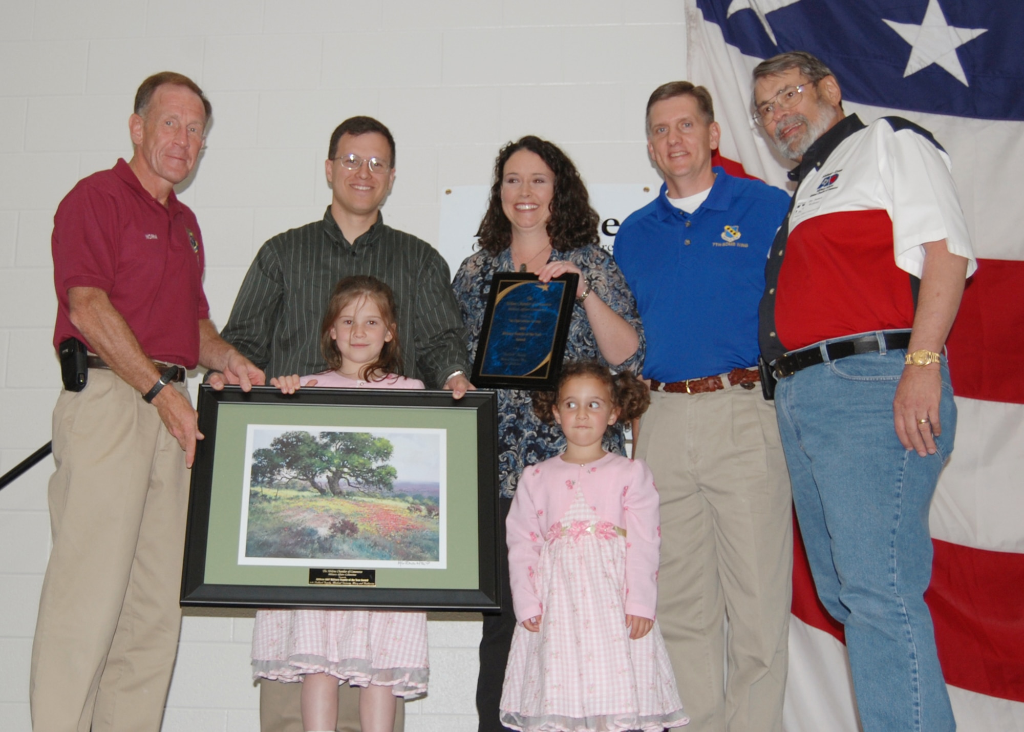 ABILENE, Texas -- The Ballard family is presented the Military Family of the Year award by Lt. Gen. Norman Seip, 12th Air Force commander (left), during the World's Largest Barbeque April 18 at the Abilene Civic Center. (U.S. Air Force photo by Airman 1st Class Jennifer Romig)